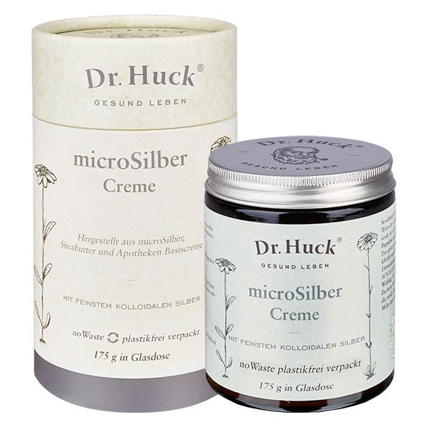 Glasdose und zylindrische Verpackung mit Aufschrift Dr. Huck microSilber Creme. Beide mit floralen Illustrationen.