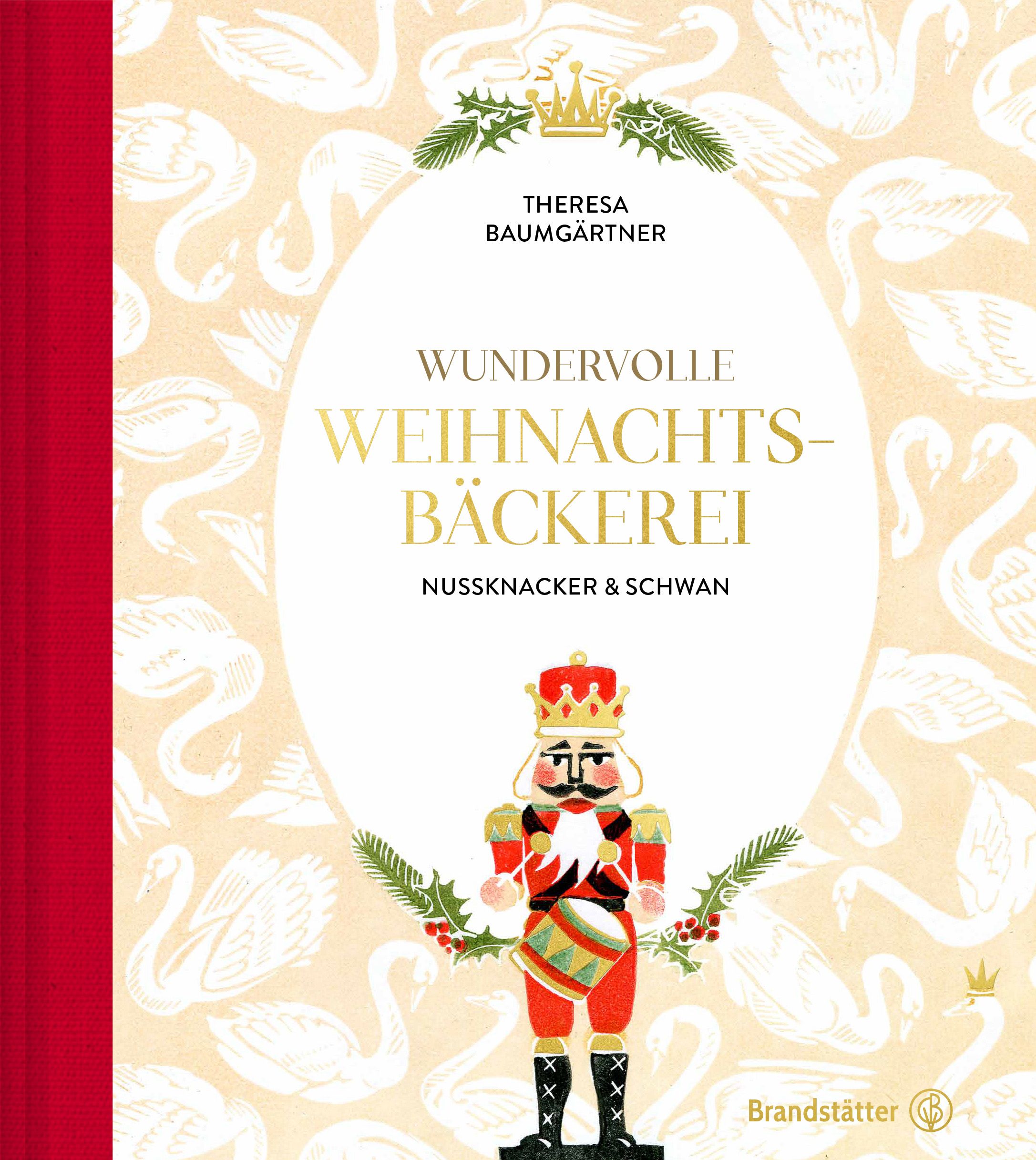 Buchcover mit Titel "Wundervolle Weihnachtsbäckerei". Illustration eines Nussknackers mit Krone und Trommel. Hintergrund mit Schwänen.