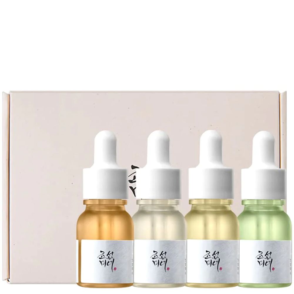 Vier kleine Serumflaschen in einer Geschenkbox.
