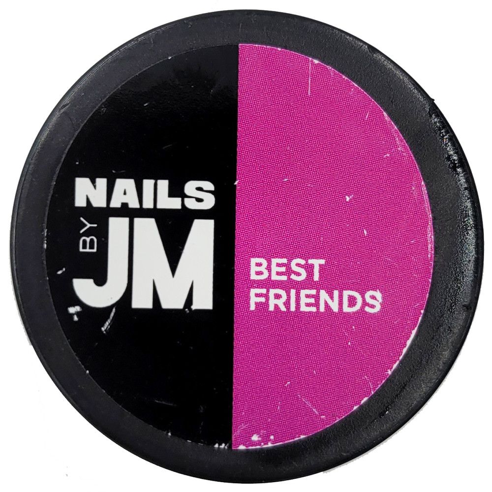Runder Behälter, geteilt in Schwarz und Pink. Auf Schwarz: "NAILS BY JM". Auf Pink: "BEST FRIENDS".