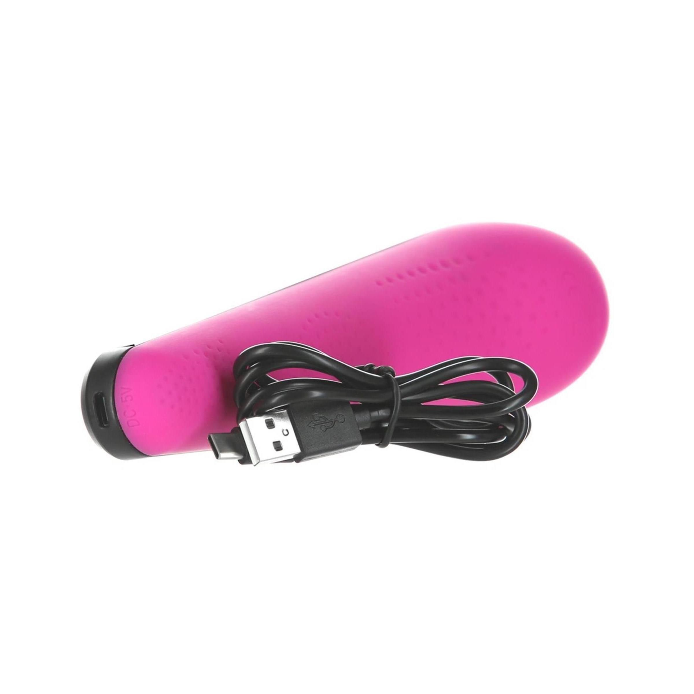 Pinkfarbenes Massagegerät mit USB-Anschluss. Schwarzes Kabel.