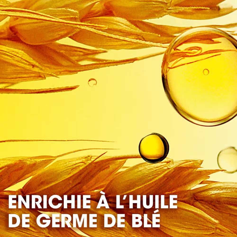 Gelbe Flüssigkeit und Getreideähren. Text: ENRICHIE À L'HUILE DE GERME DE BLÉ.