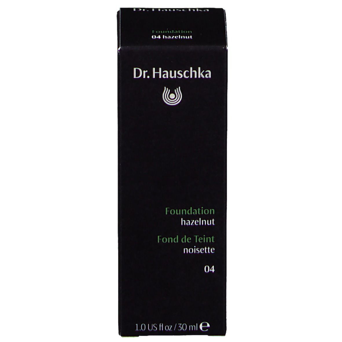 Schwarze Schachtel mit Dr. Hauschka-Logo, Produktname und Farbton. Text: Foundation hazelnut, 04.