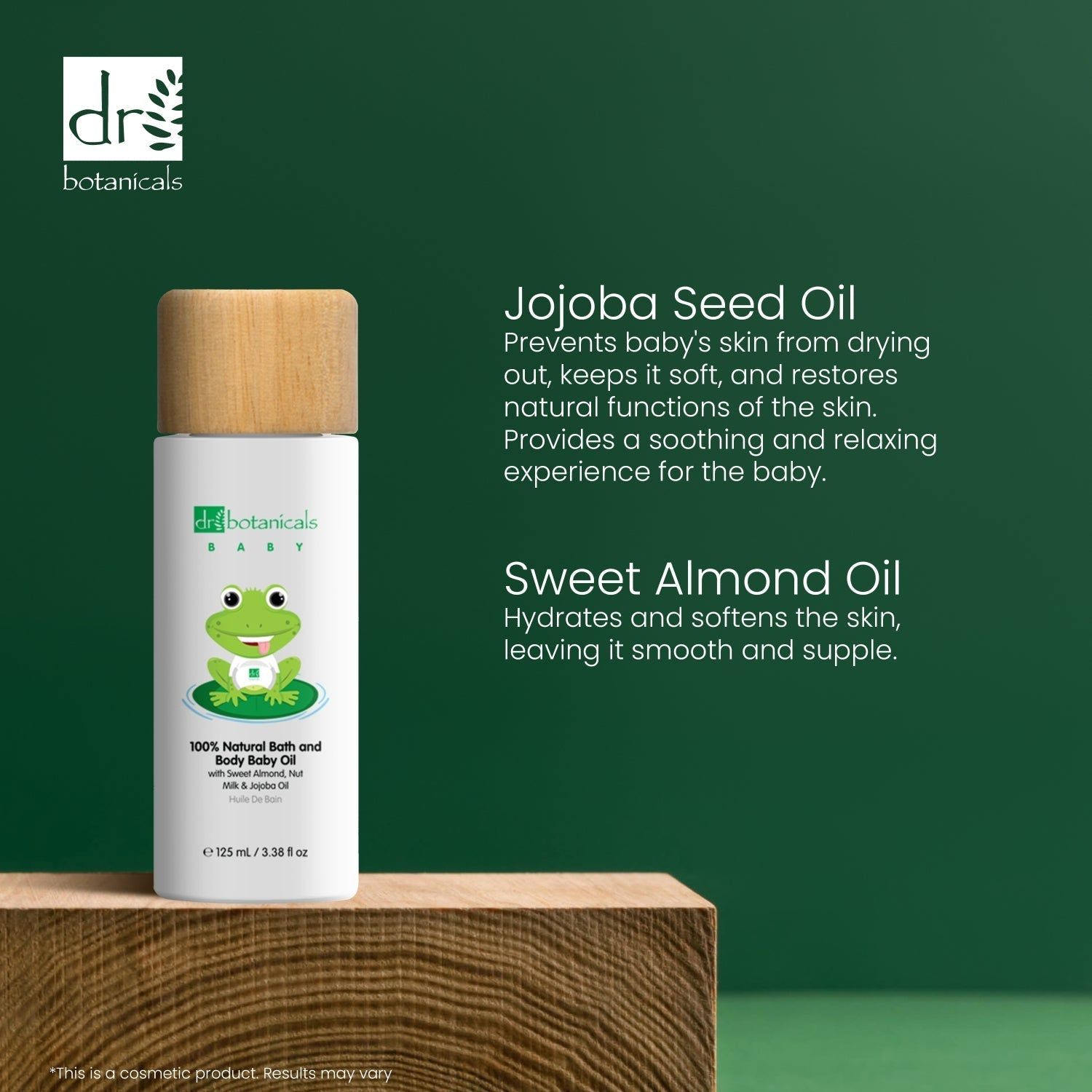 Flasche auf Holzblock. Text: Jojoba Seed Oil, Sweet Almond Oil. Flasche mit Frosch-Illustration.
