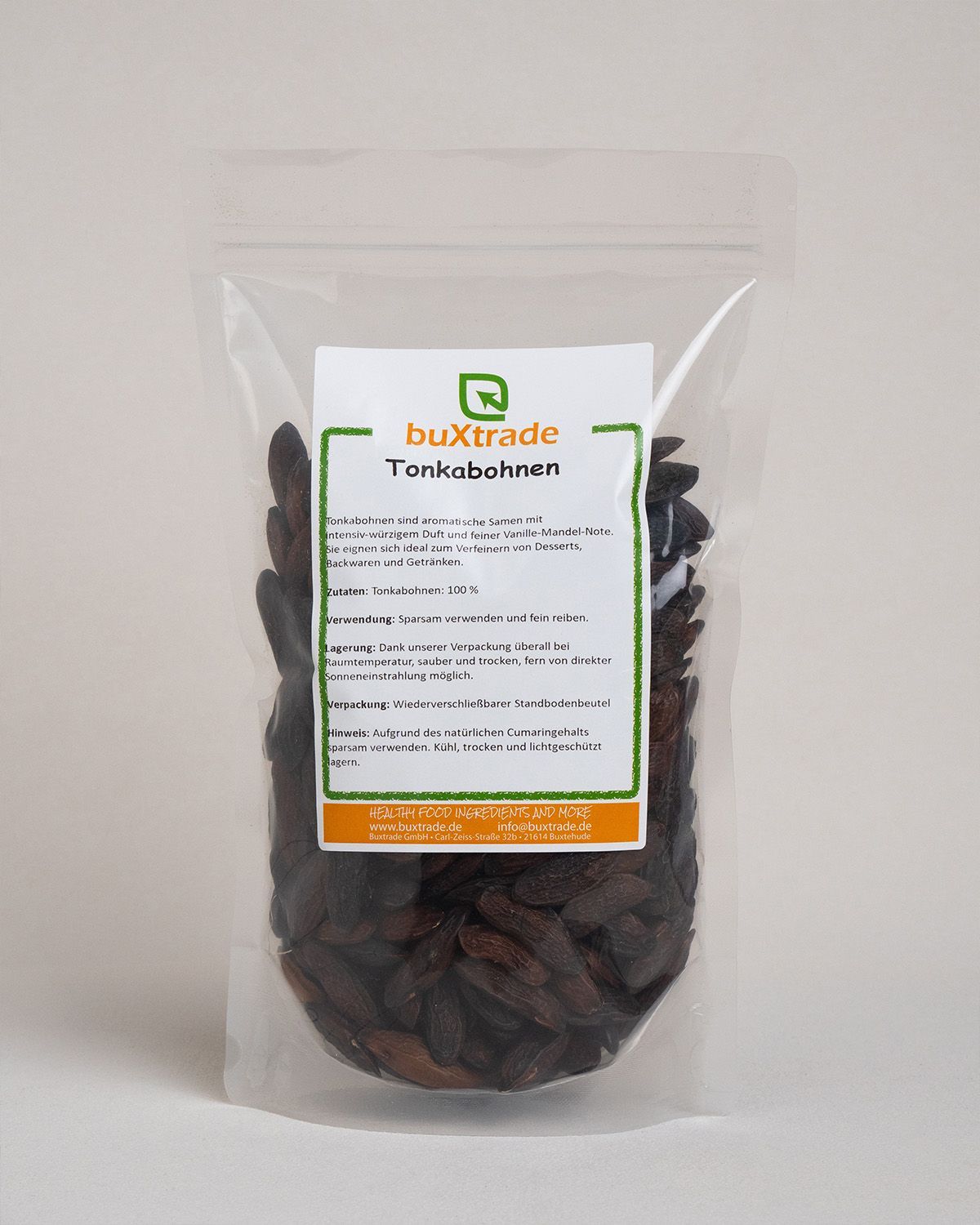 Verpackung mit buXtrade Tonkabohnen, klare Tüte mit Etikett.