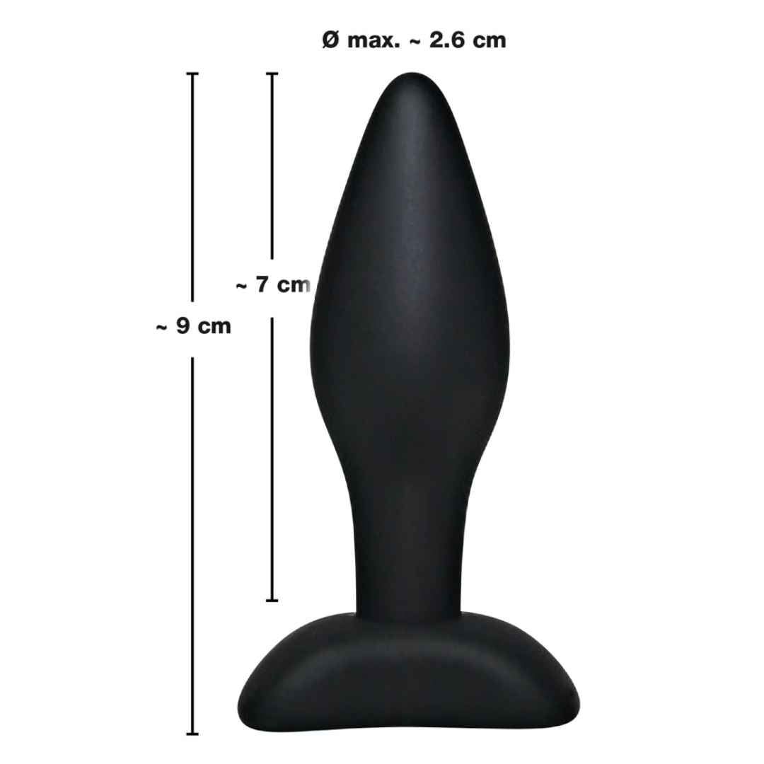 Schwarzer Analplug mit Standfuß, schmaler Spitze und verbreitertem Schaft. Maße: Ø max. 2,6 cm, 7 cm lang, 9 cm Gesamtlänge.