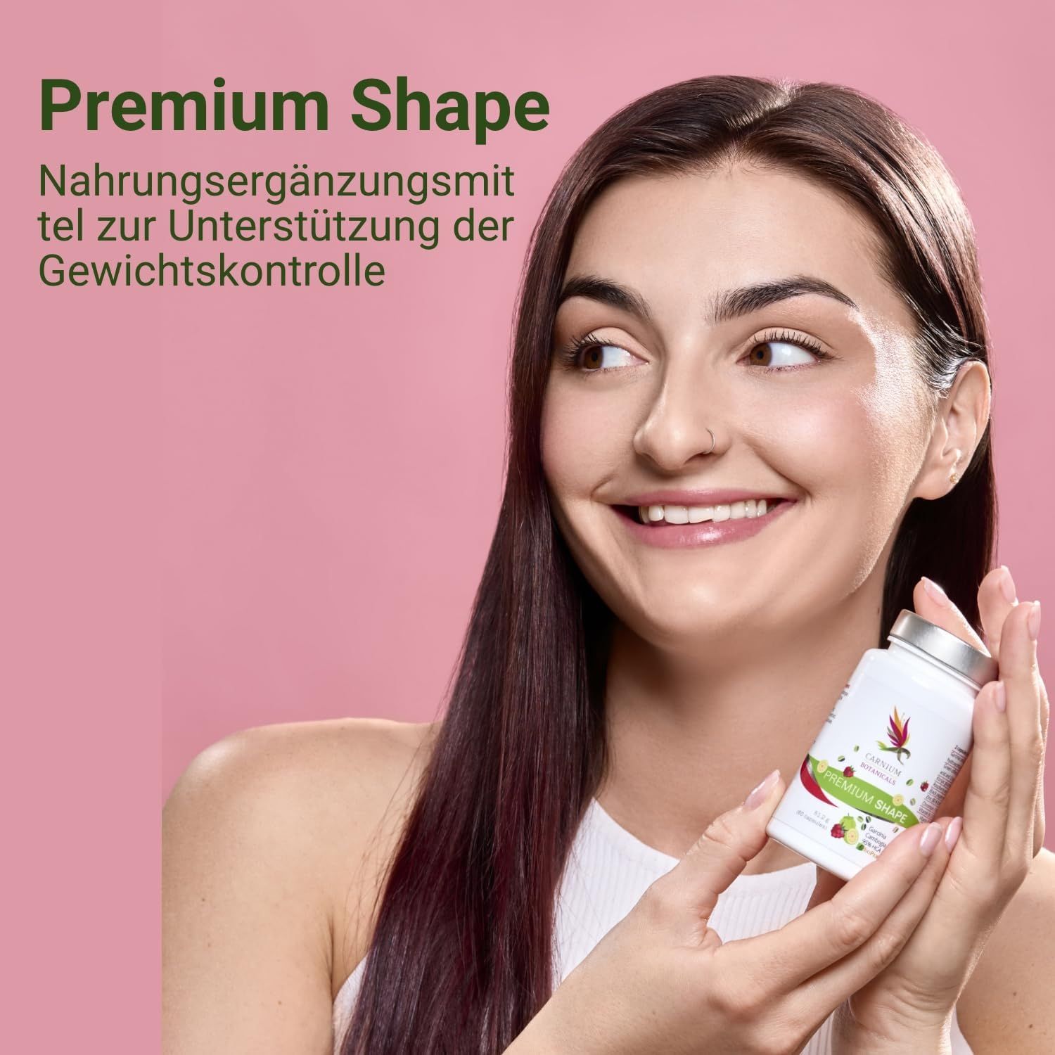 Frau hält eine weiße Flasche. Aufschrift "Premium Shape". Text: Nahrungsergänzungsmittel zur Unterstützung der Gewichtskontrolle. Rosa Hintergrund.