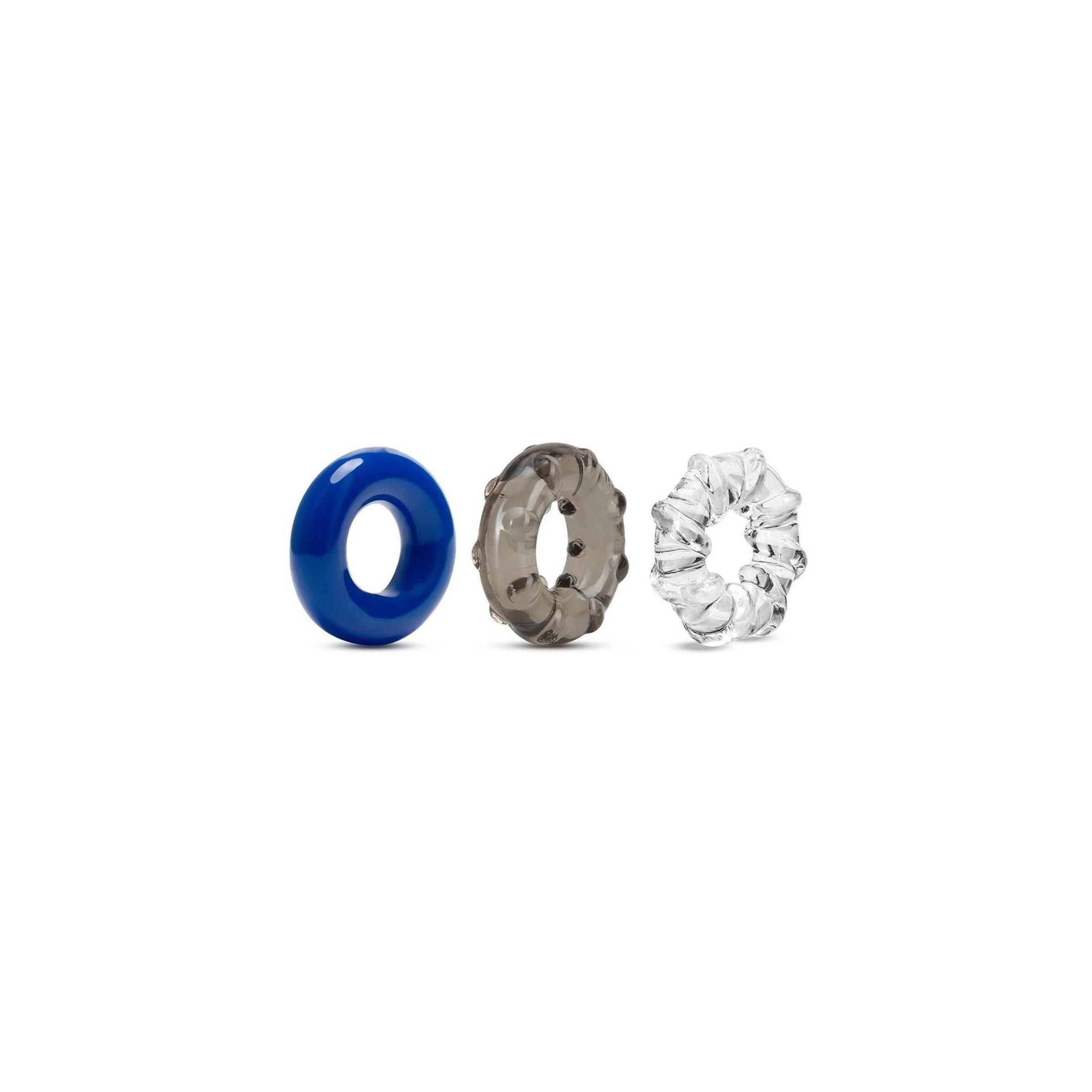 Drei Cockringe in Blau, Grau und Transparent. Ringe mit glatter und strukturierter Oberfläche.
