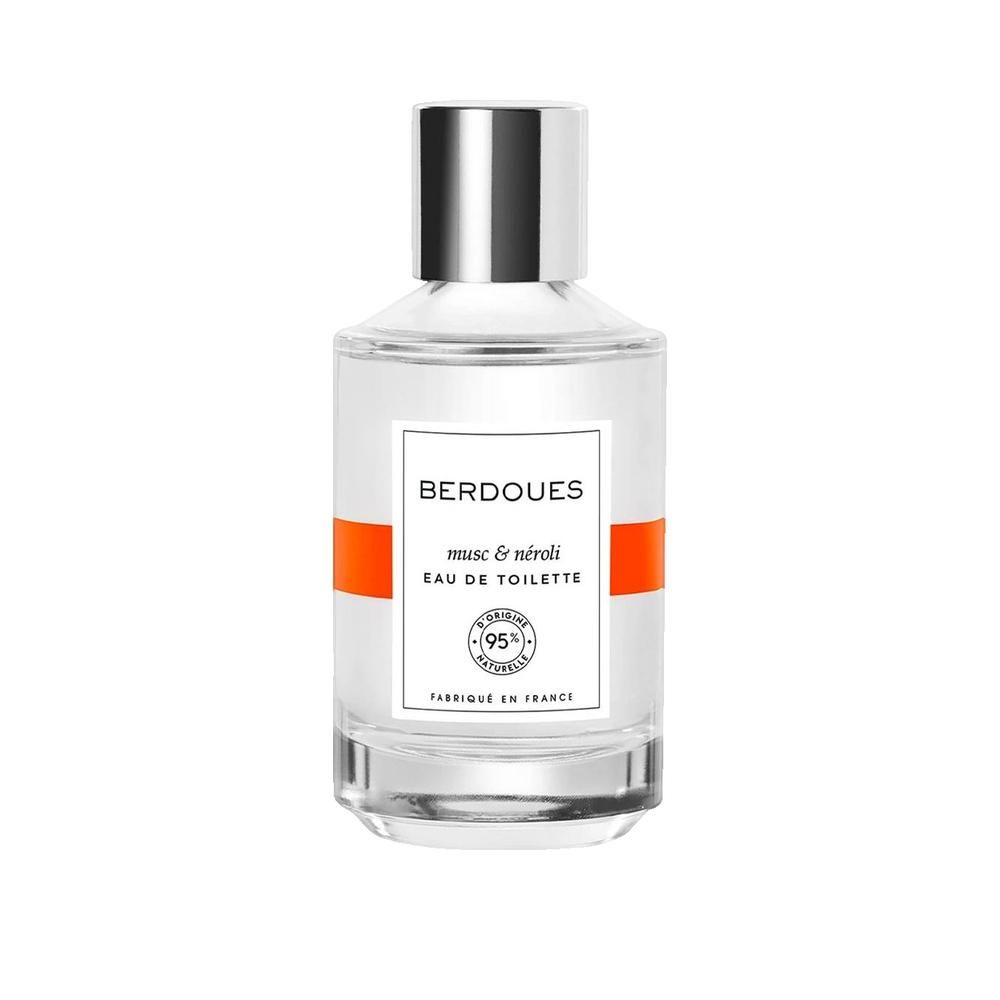 Flakon mit silbernem Verschluss, weißem Etikett und orangefarbenem Streifen. Aufschrift: BERDOUES, musc & néroli, Eau de Toilette.