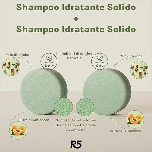 Zwei runde, grüne Shampoo-Stücke. Text: 'Shampoo Idratante Solido'. Zutaten: Jojobaöl, Aprikosenbutter. 'R5' Logo.