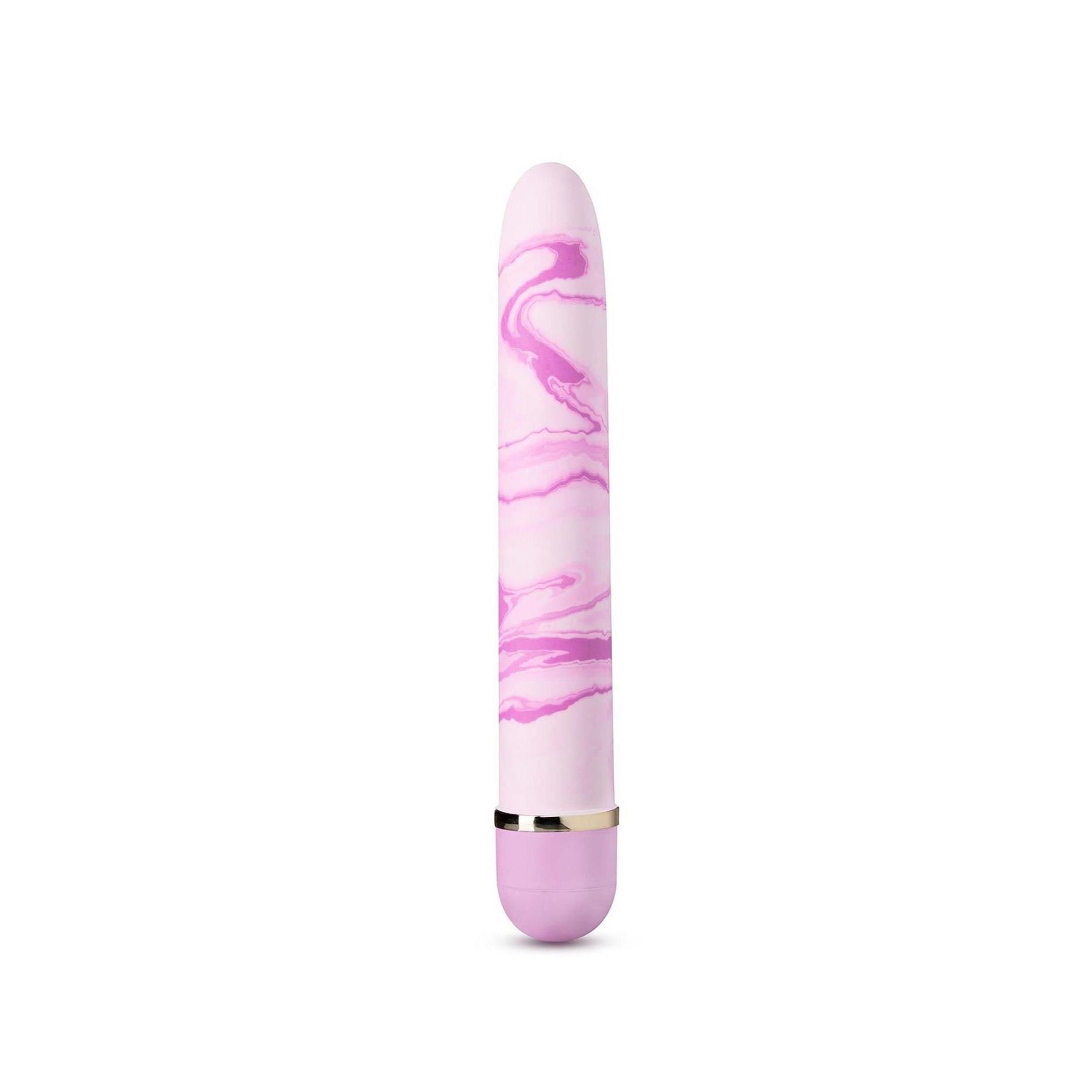 Zylindrisches Wellness-Produkt mit rosa Marmormuster. Silberfarbener Ring und abgerundete Spitze.