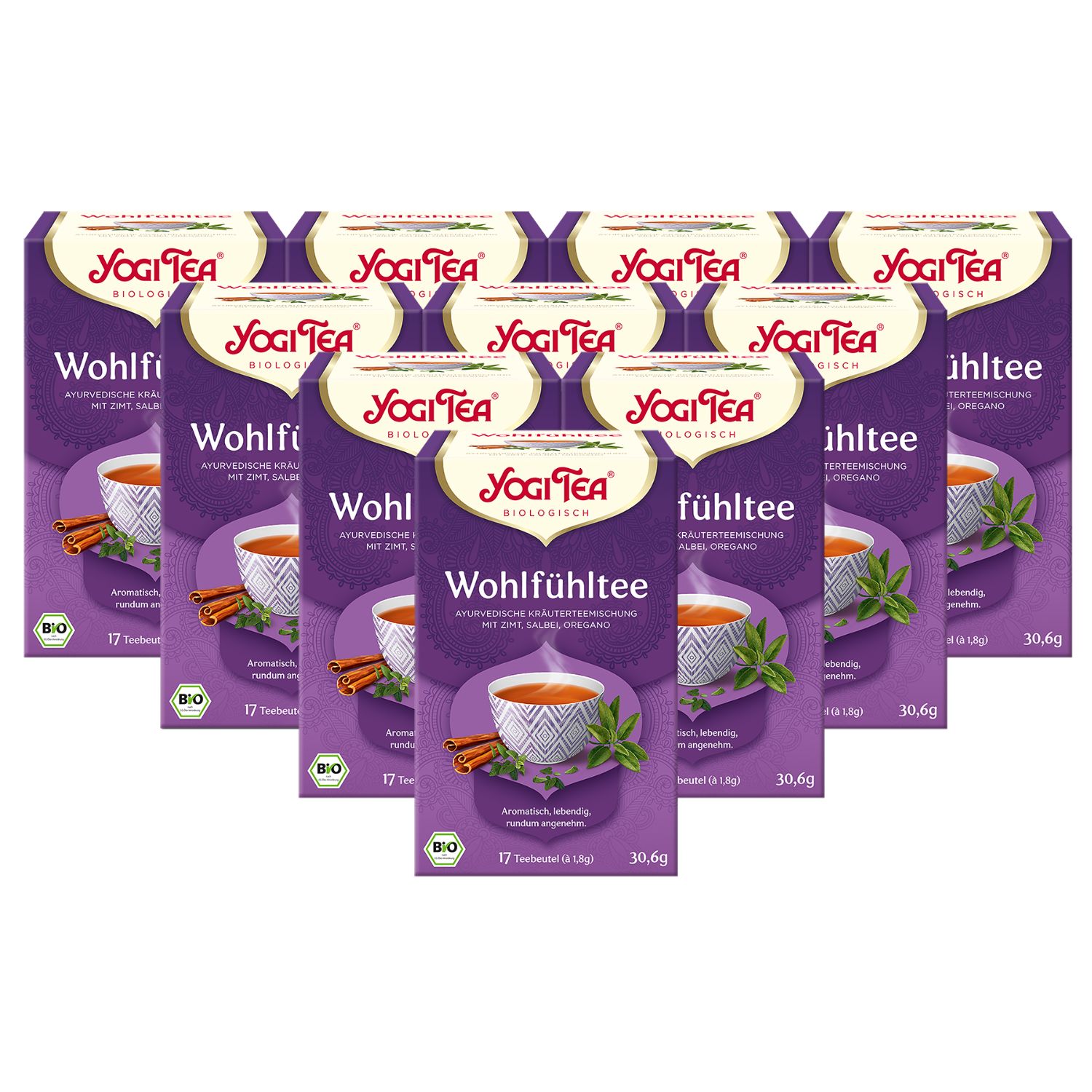 Mehrere Packungen Yogi Tea Wohlfühltee. Lila Verpackung mit Logo, Produktname und Abbildung einer Tasse Tee mit Zimt und Kräutern. Bio-Siegel.