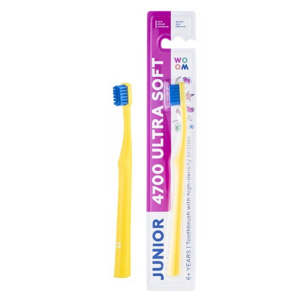 Gelbe Zahnbürste und Verpackung. Auf der Verpackung steht 'JUNIOR 4700 ULTRA SOFT'.