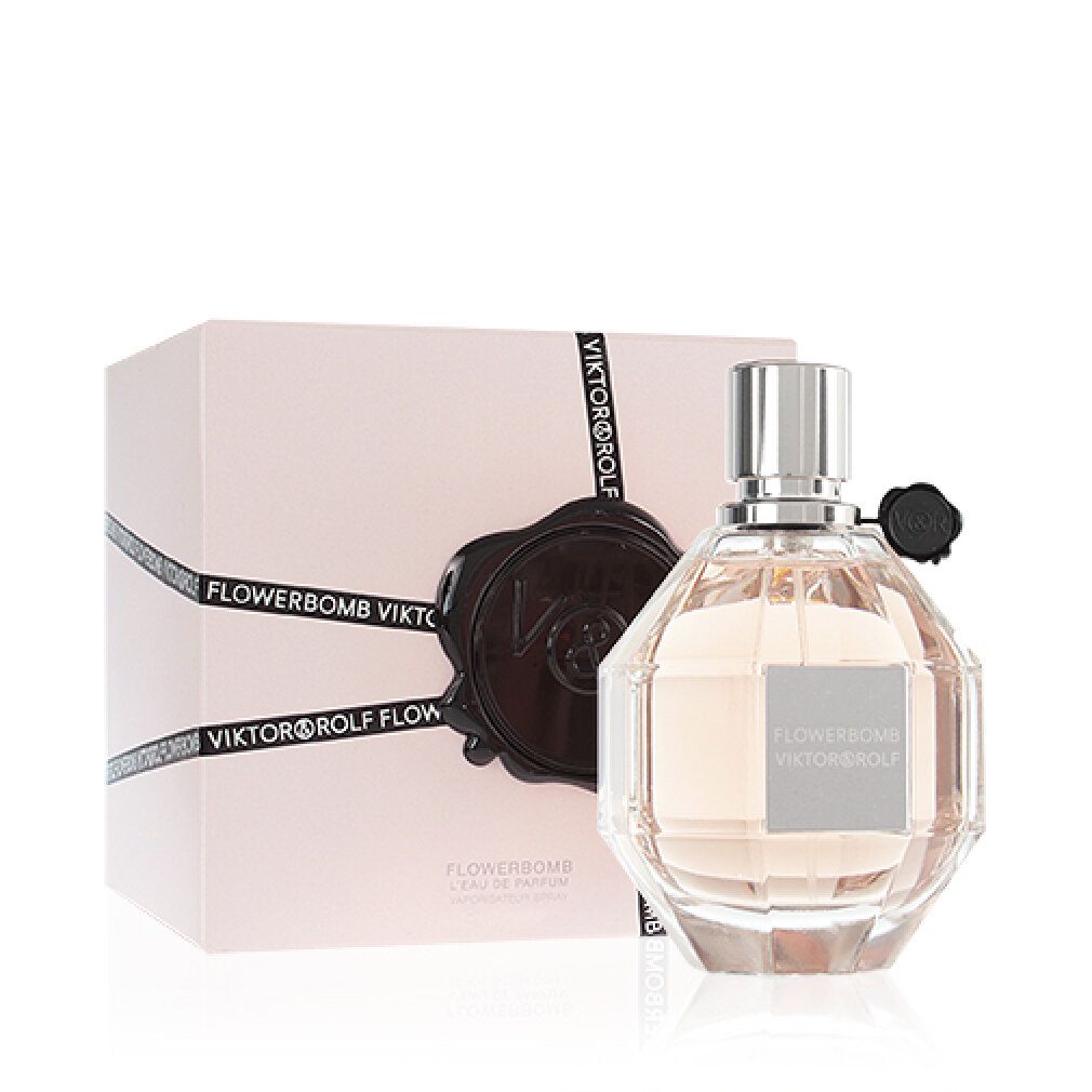 Parfümflakon mit rosafarbenem Inhalt. Aufschrift: Flowerbomb Viktor & Rolf. Verpackung.