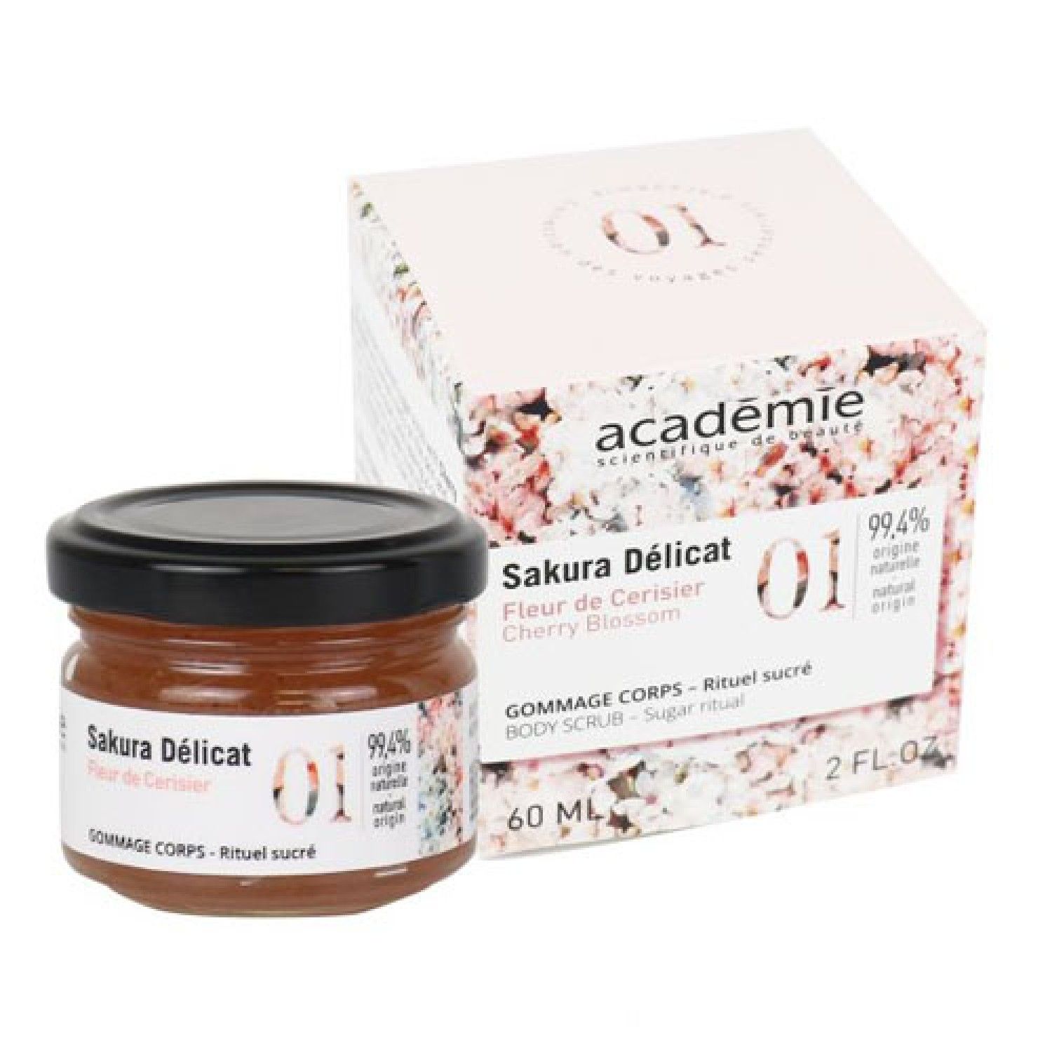 Glas mit Körperpeeling und Verpackung. Aufschrift: Sakura Délicat, Cherry Blossom. 99,4% natürlichen Ursprungs. 60 ml.