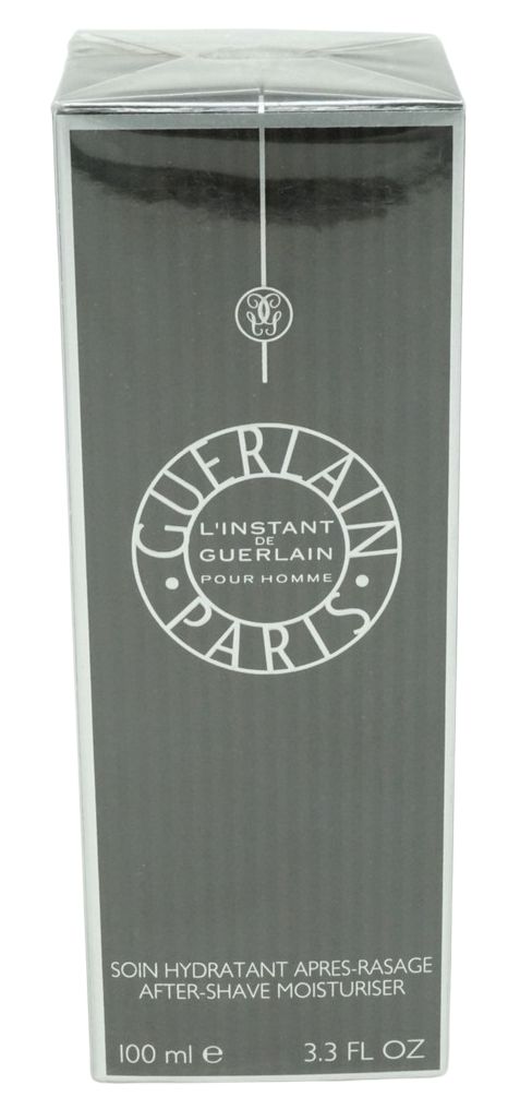 Graue Schachtel mit weißem Logo und Text. Enthält „L'Instant de Guerlain Pour Homme“. Untertitel: „SOIN HYDRATANT APRES-RASAGE“.