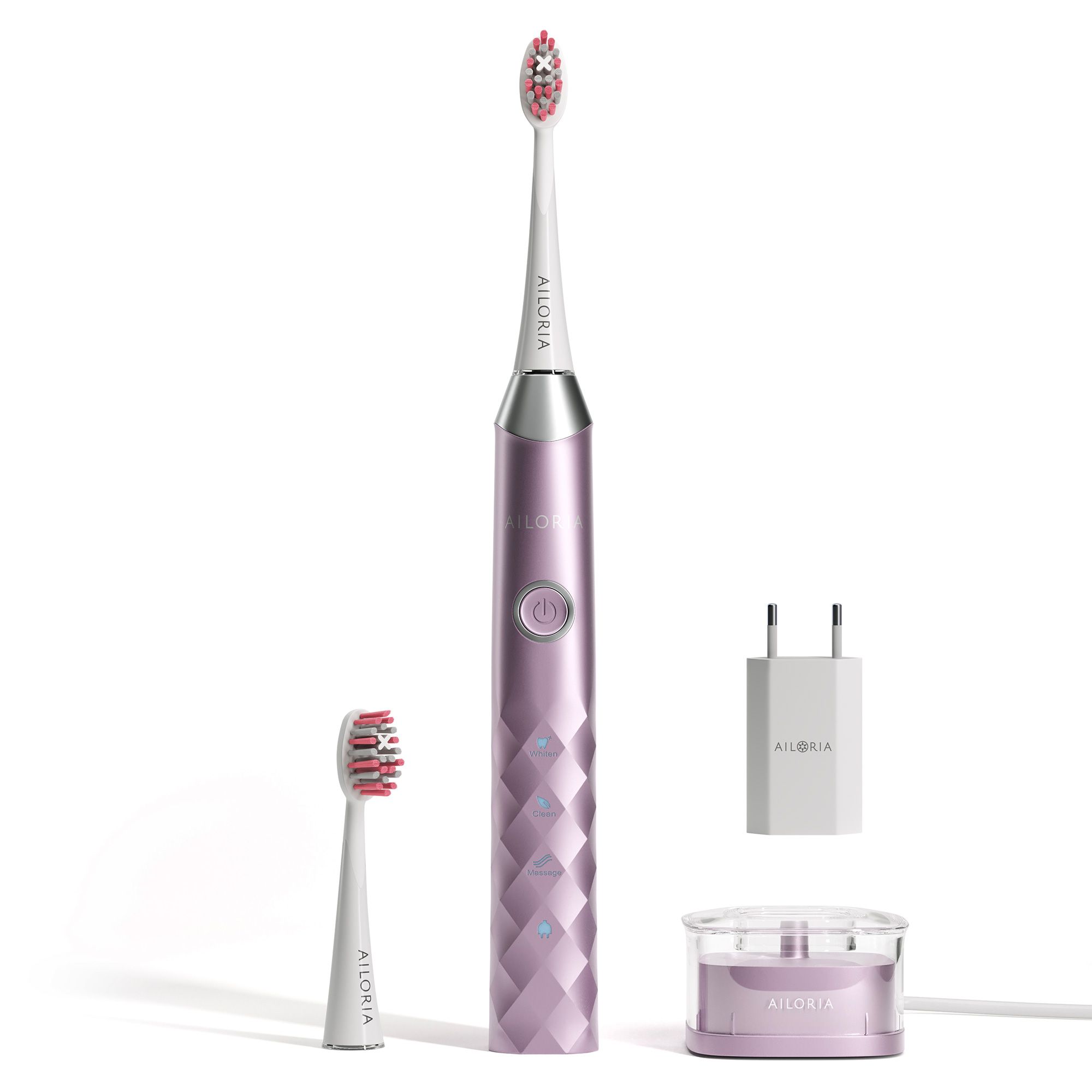 Elektrische Zahnbürste, rosa. Inklusive Ladestation, Ersatzbürste und Netzteil. AILORIA-Logo sichtbar.