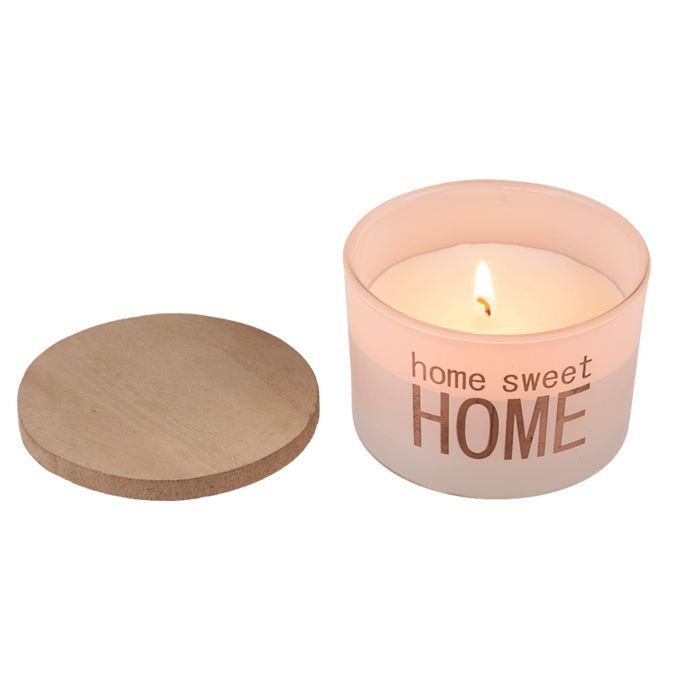 Bougie parfumée avec couvercle en bois. Inscription "home sweet HOME". Bougie allumée. Couvercle à côté.