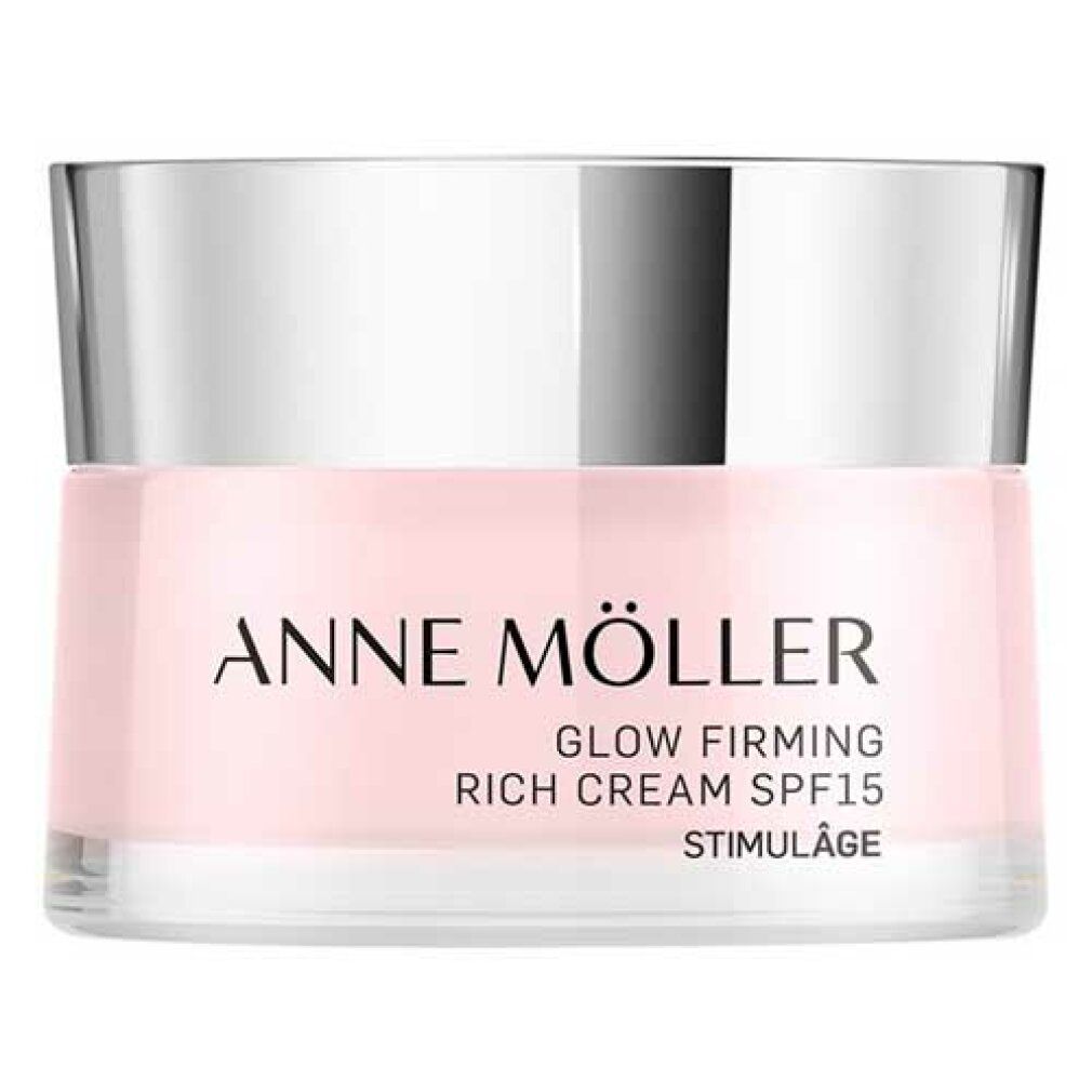 Rosa Creme-Tiegel mit silbernem Deckel. Aufschrift: ANNE MÖLLER, GLOW FIRMING, RICH CREAM SPF15, STIMULÂGE.