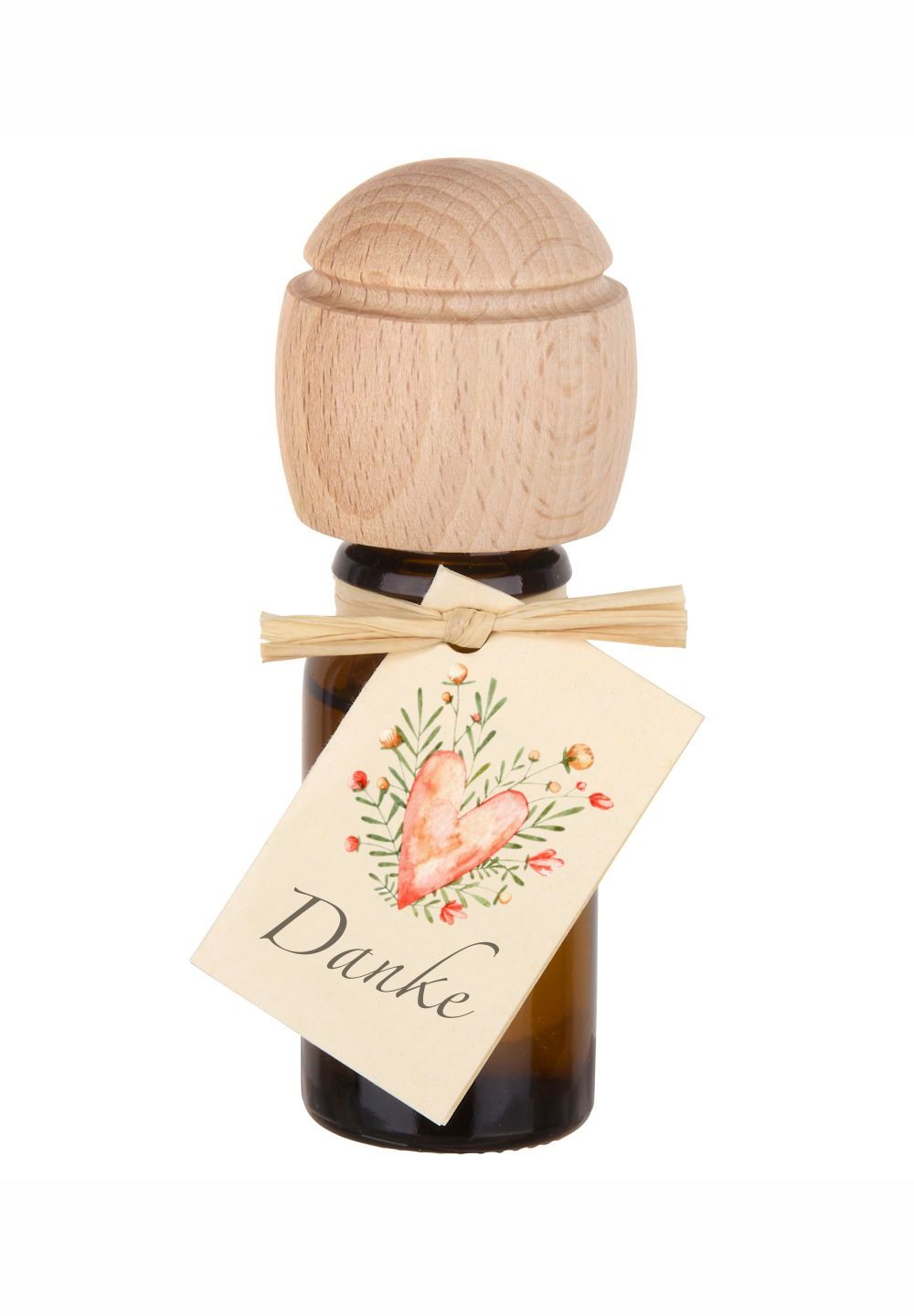 Glasflasche mit Duftöl, Buchenholzkopf und Anhänger mit Herzmotiv und Schriftzug 'Danke'.