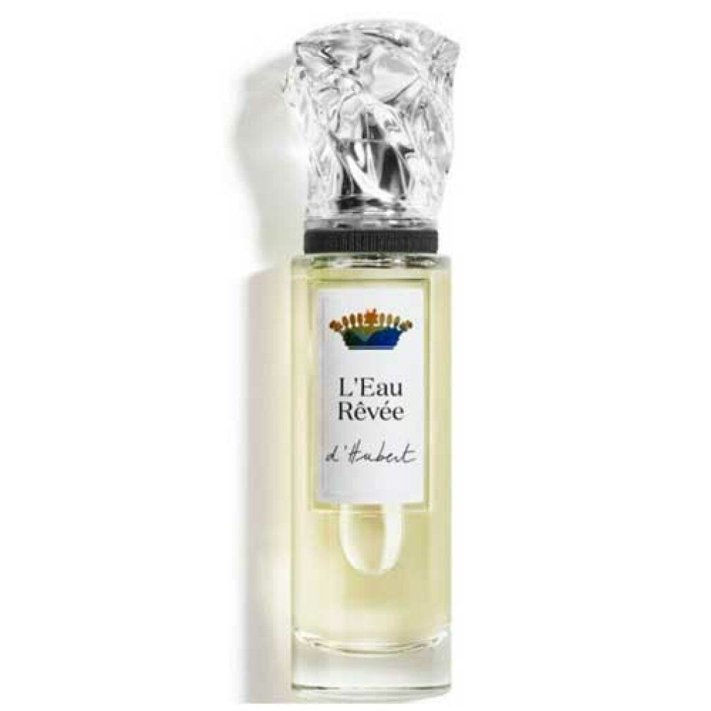 Flakon mit transparentem Glas, silbernem Verschluss und Etikett mit Schriftzug L'Eau Rêvée d'Hubert. Flüssigkeit hellgelb.