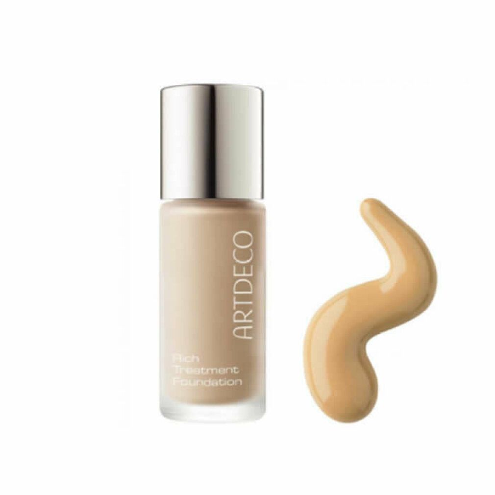 Artdeco Rich Treatment Foundation Flasche und Foundation-Tropfen. Beige Foundation in einer Glasflasche.