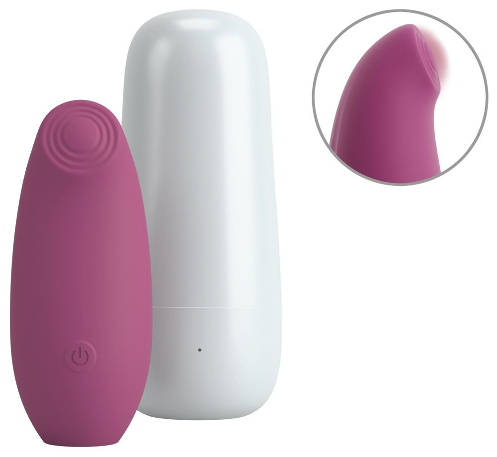Rosa Stimulator mit weißem Ladecase. Der Stimulator hat eine ovale Form mit einem Knopf und einem geriffelten Kopf. Detailansicht des Kopfes.