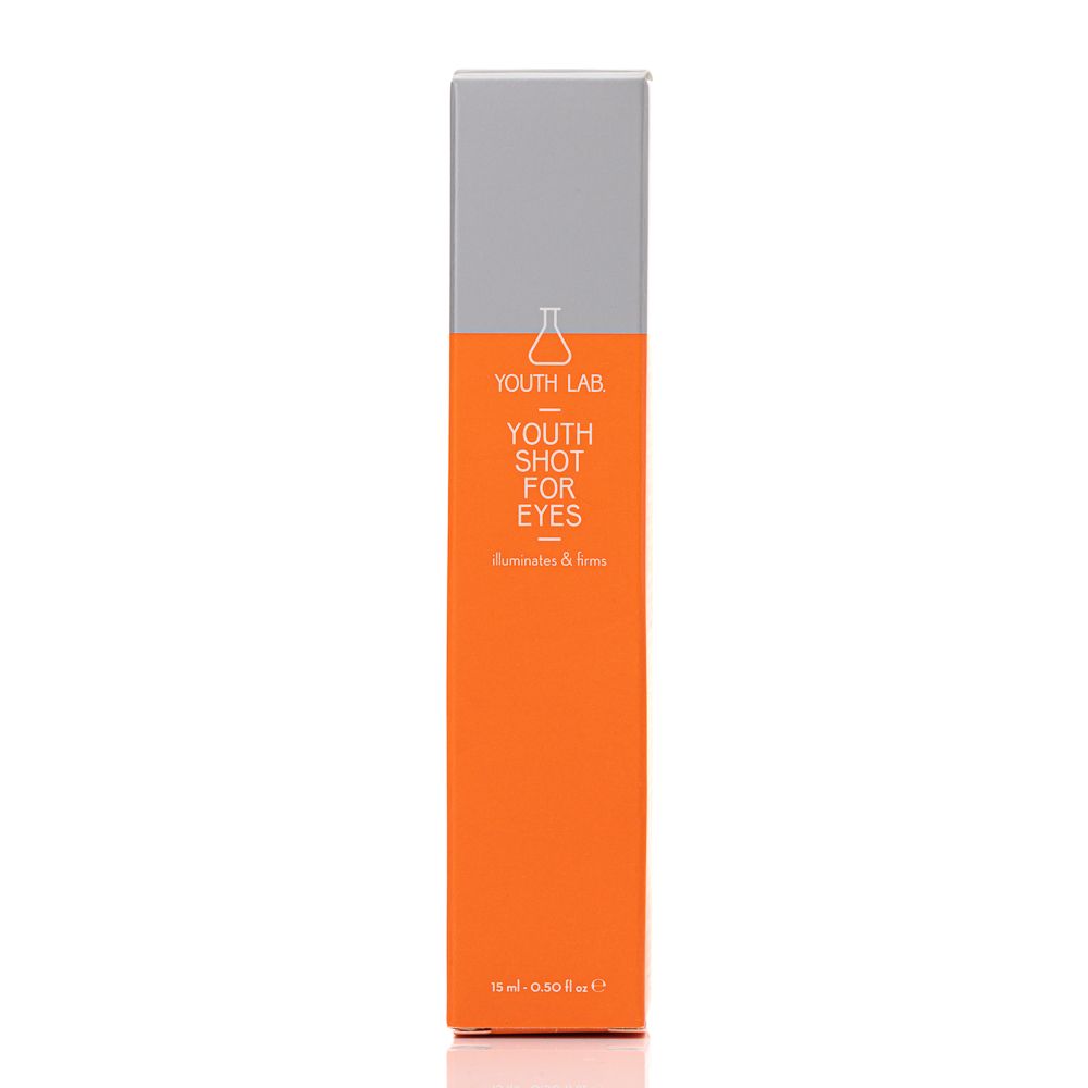 Schachtel mit Aufschrift: YOUTH LAB YOUTH SHOT FOR EYES. Text: Illuminates & firms. Orange-graue Verpackung.