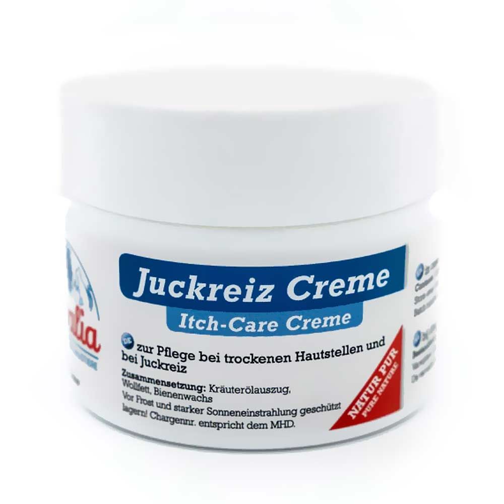 Weiße Dose mit blauem Etikett. Aufschrift: Juckreiz Creme, Itch-Care Creme. Roter Aufkleber: Natur Pur.