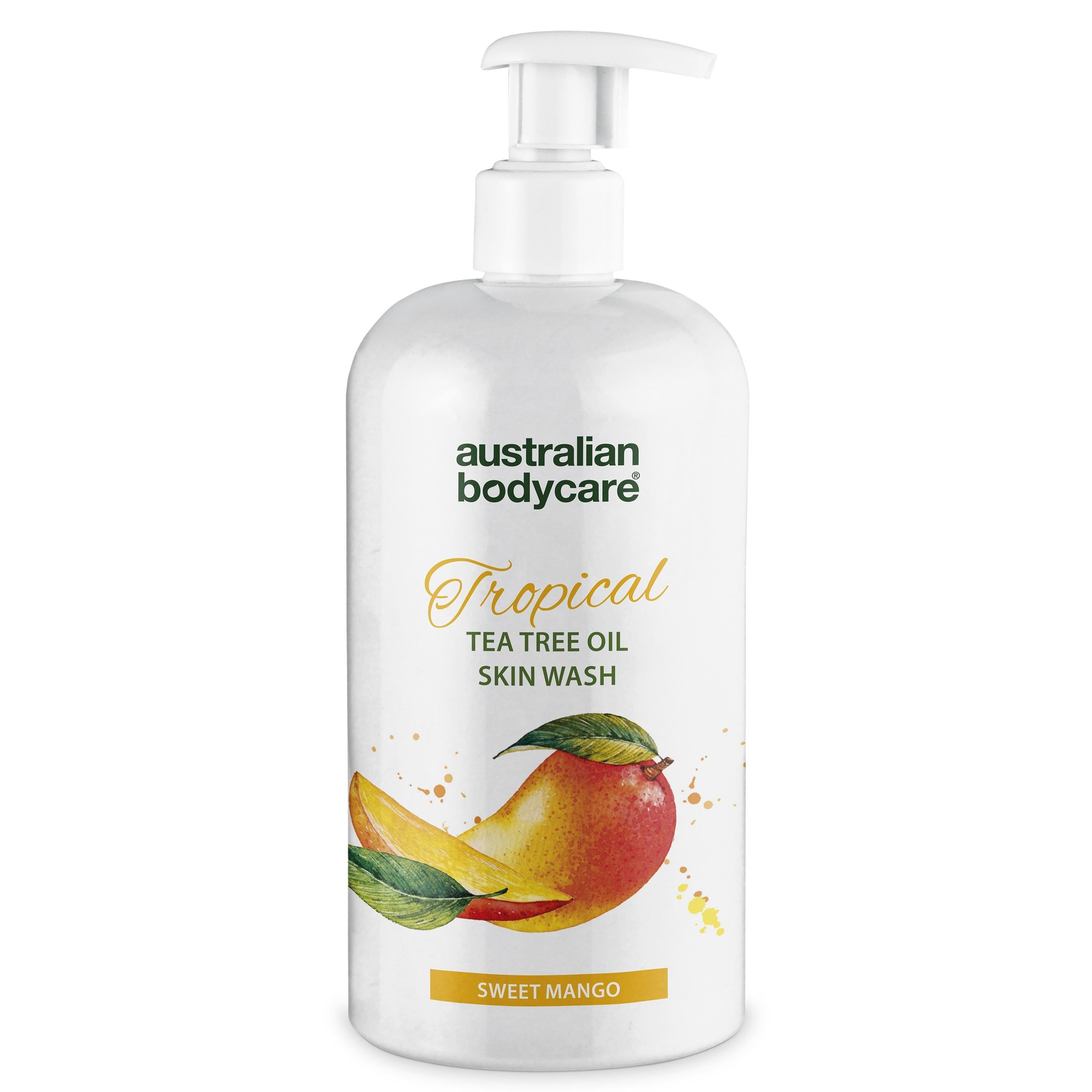 Weiße Flasche mit Pumpe. Aufschrift: Australian Bodycare, Tropical Tea Tree Oil Skin Wash, Mango-Illustration.