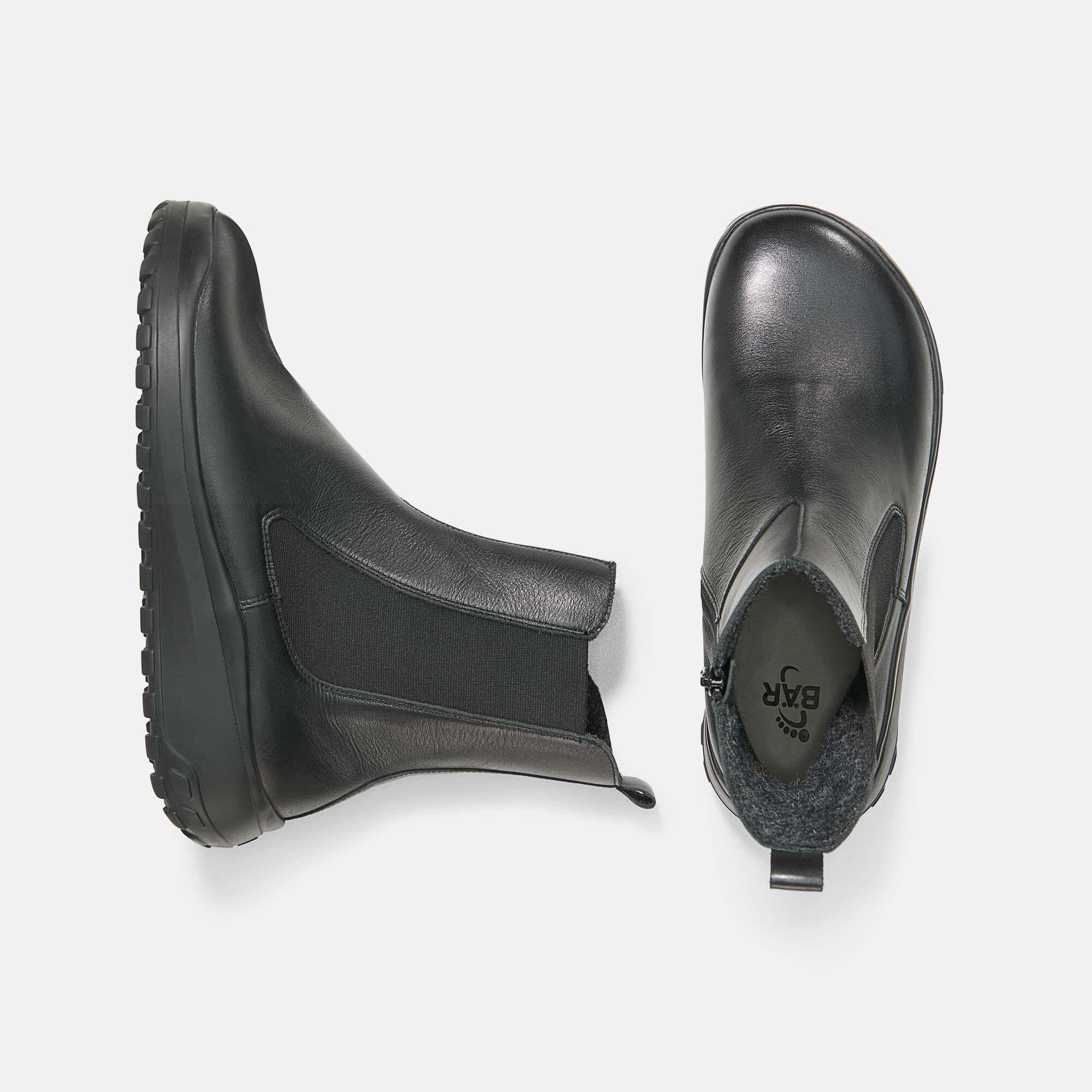 Schwarze Leder-Chelsea-Boots, Paaransicht mit Reißverschluss und Fütterung.