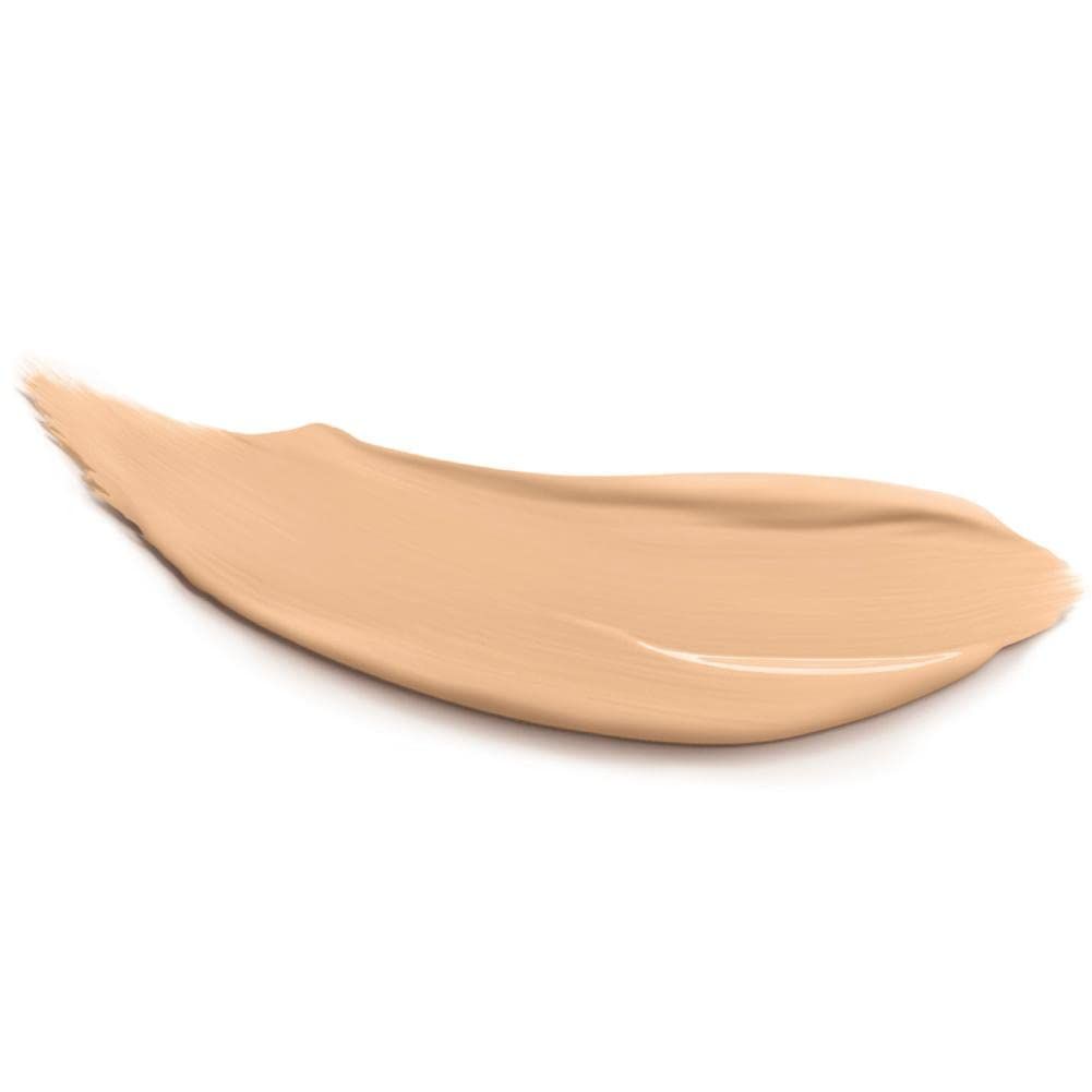Beigefarbener Concealer-Abstrich auf weißem Hintergrund. Textur sichtbar.