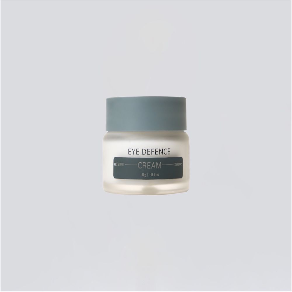Creme-Glas mit grauem Deckel. Aufschrift: Eye Defence Cream.