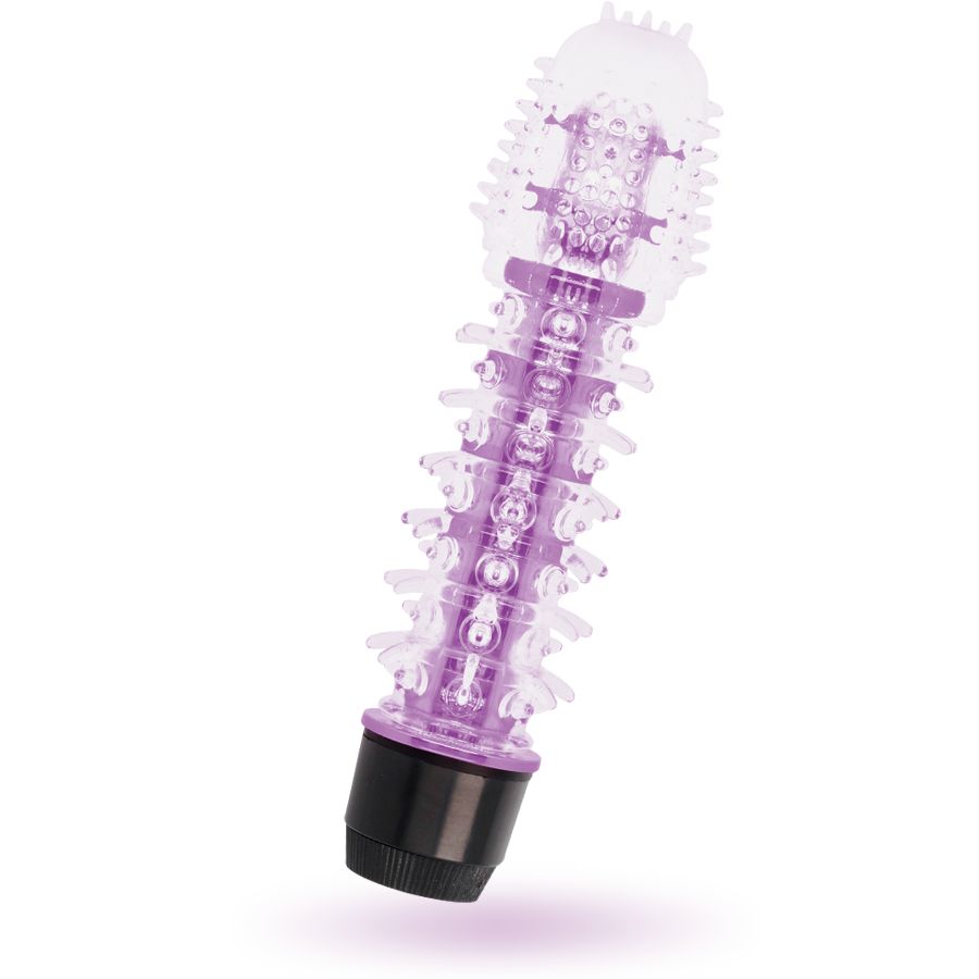 Lila Vibrator mit Reiznoppen. Schwarzer Sockel. Transparente, geriffelte Oberfläche. Auf weißem Hintergrund.