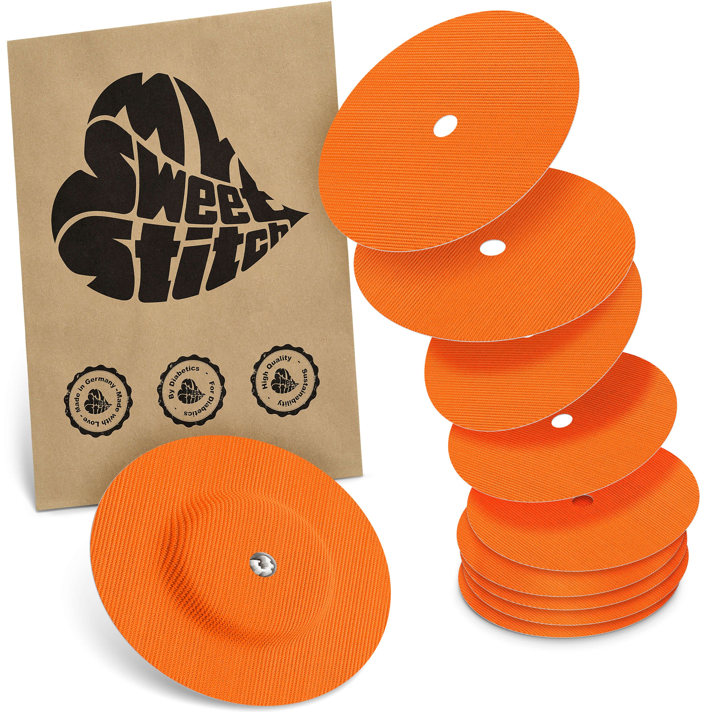 Orange runde Freestyle Libre 1 & 2 Überpflaster mit zentralem Loch. Enthält eine Packung und mehrere Pflaster.