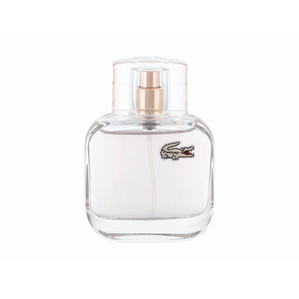 Parfümflakon mit Sprühkopf und Krokodil-Logo. Transparenter Flakon mit rosa Flüssigkeit. Auf weißem Hintergrund.