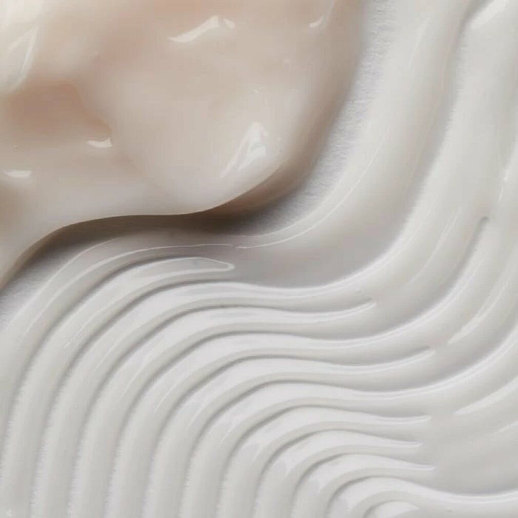 Nahaufnahme von Creme-Texturen. Wellenförmige und glatte Bereiche. Helle Farbtöne.