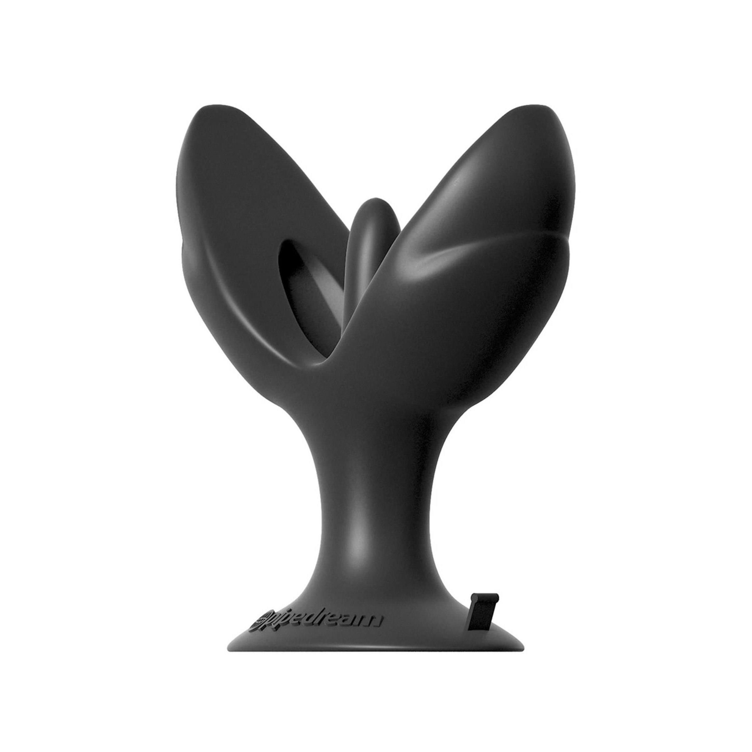 Schwarzes Wellness-Produkt. Form mit zwei Flügeln und einem zentralen Element. Basis mit Logo.