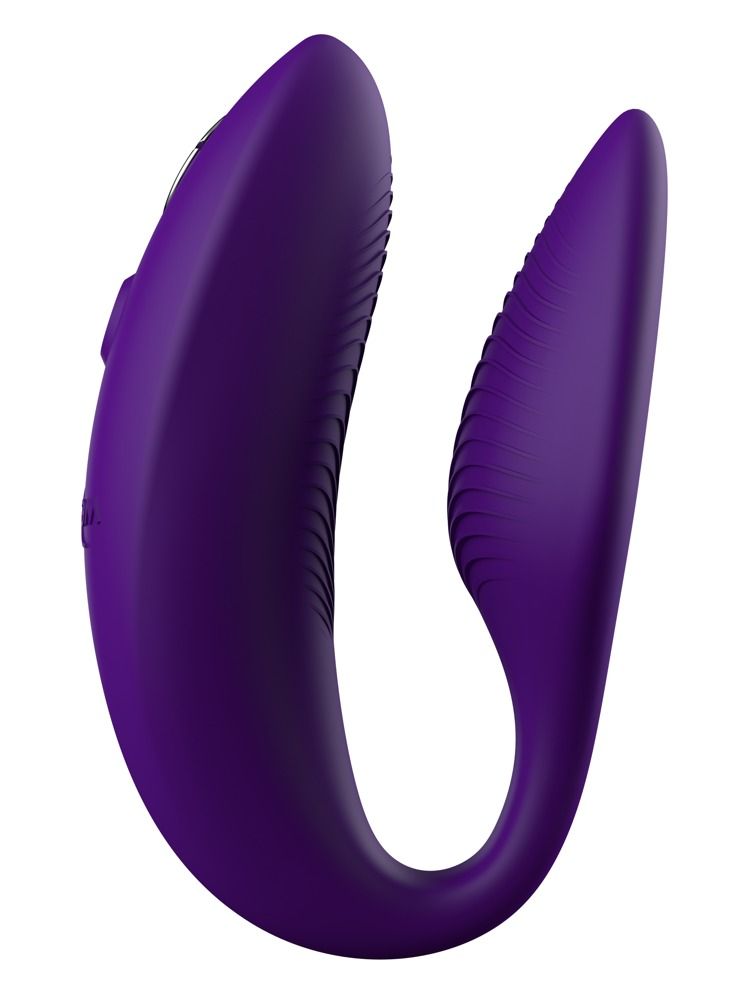 Lila Wellness-Produkt mit geschwungener Form. Geriffelte Oberfläche. Bedienelemente.