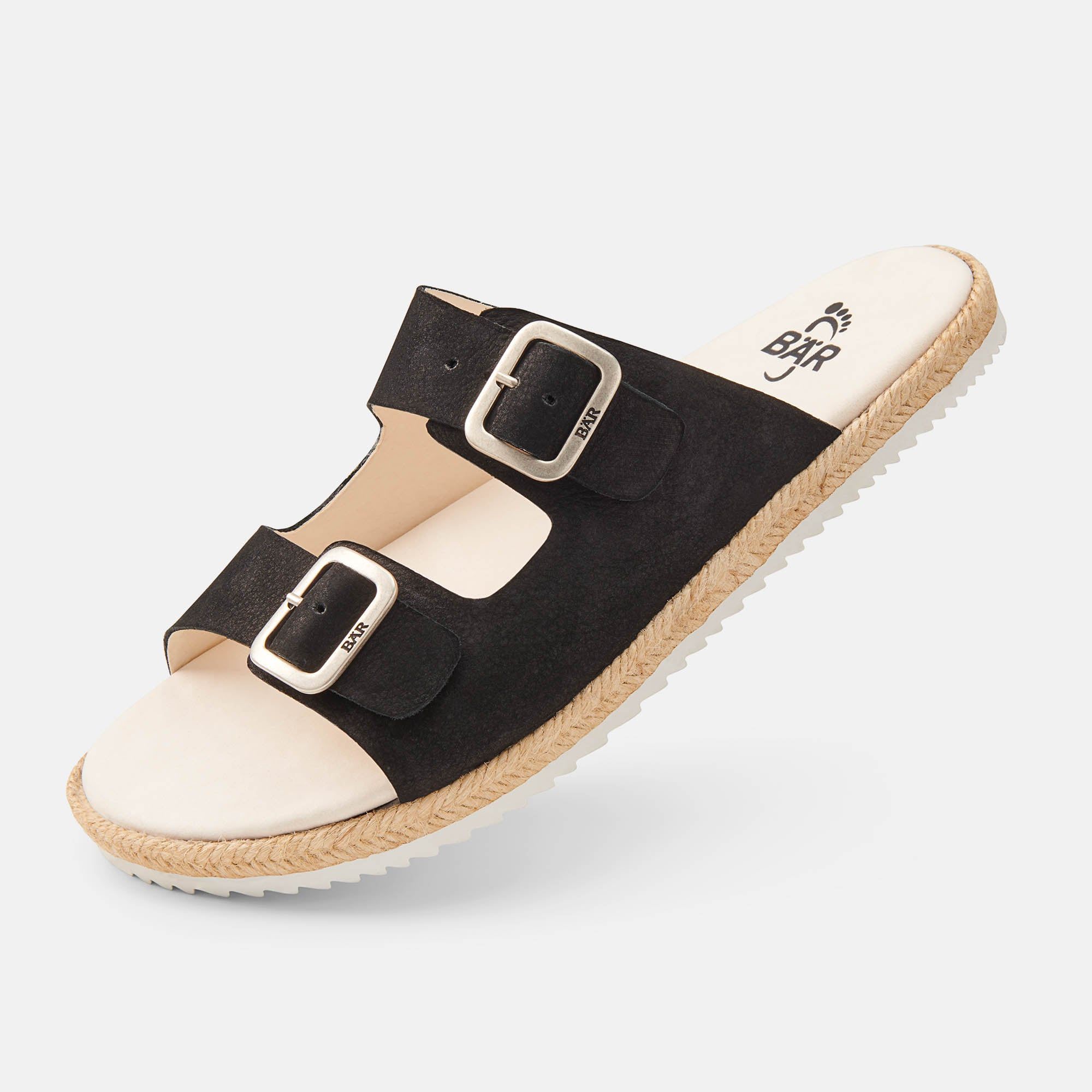 Schwarze Pantolette mit zwei Schnallen. Beige Innensohle, geflochtener Rand. Marke auf Schnallen und Sohle.