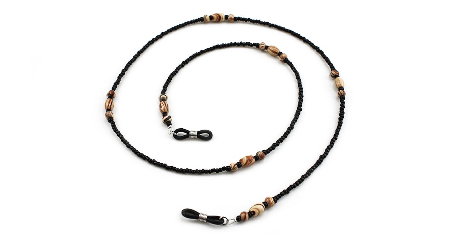 Brillenkette mit schwarzen Perlen und Holzperlen. Schwarze Gummischlaufen zur Befestigung an Brillenbügeln.