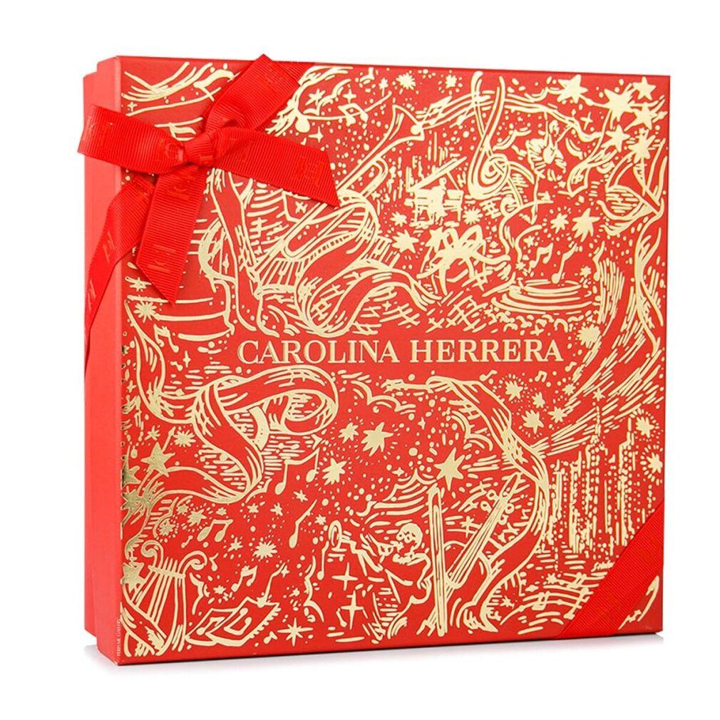 Rote Geschenkbox mit goldfarbenen Verzierungen und Schleife. Carolina Herrera-Logo sichtbar.