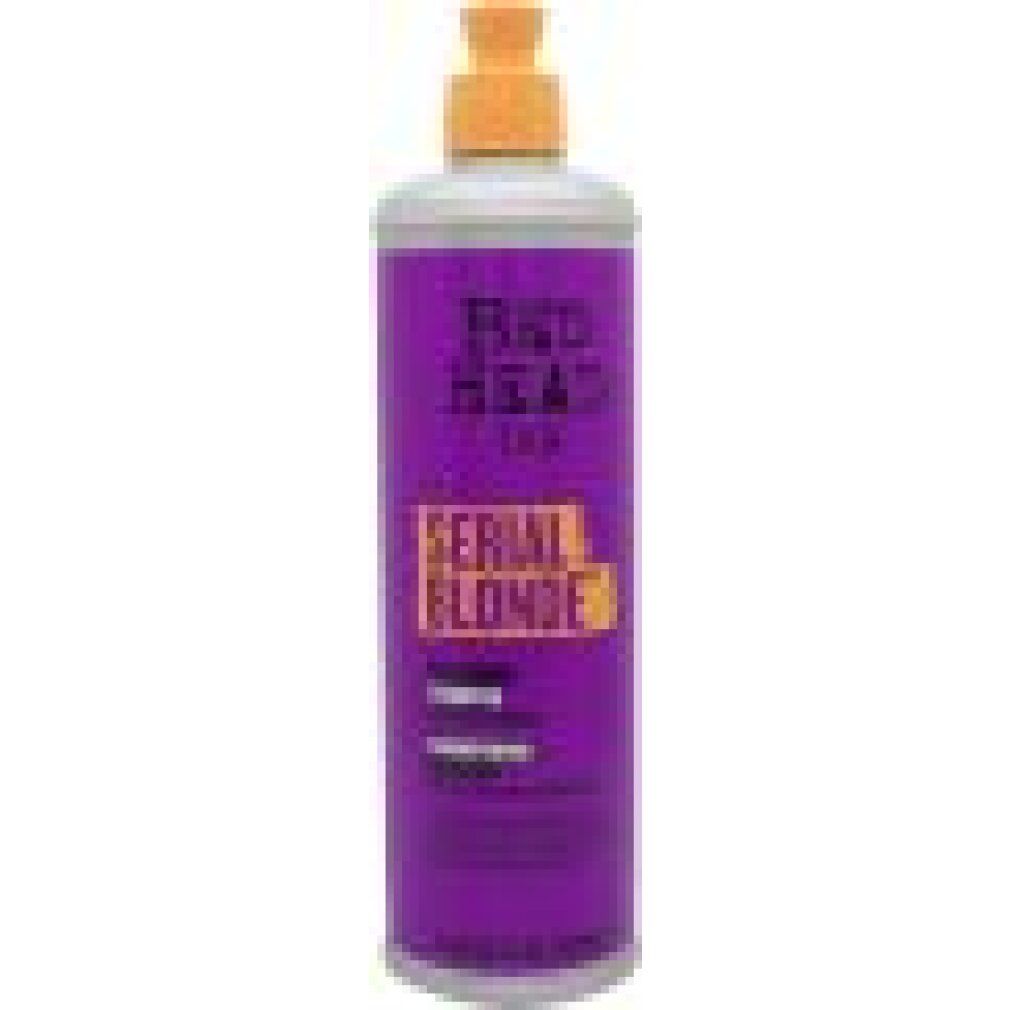TIGI Bed Head Serial Blonde Flasche mit Pumpspender. Lila Flasche mit silbernem Hals und orangefarbenem Pumpaufsatz.