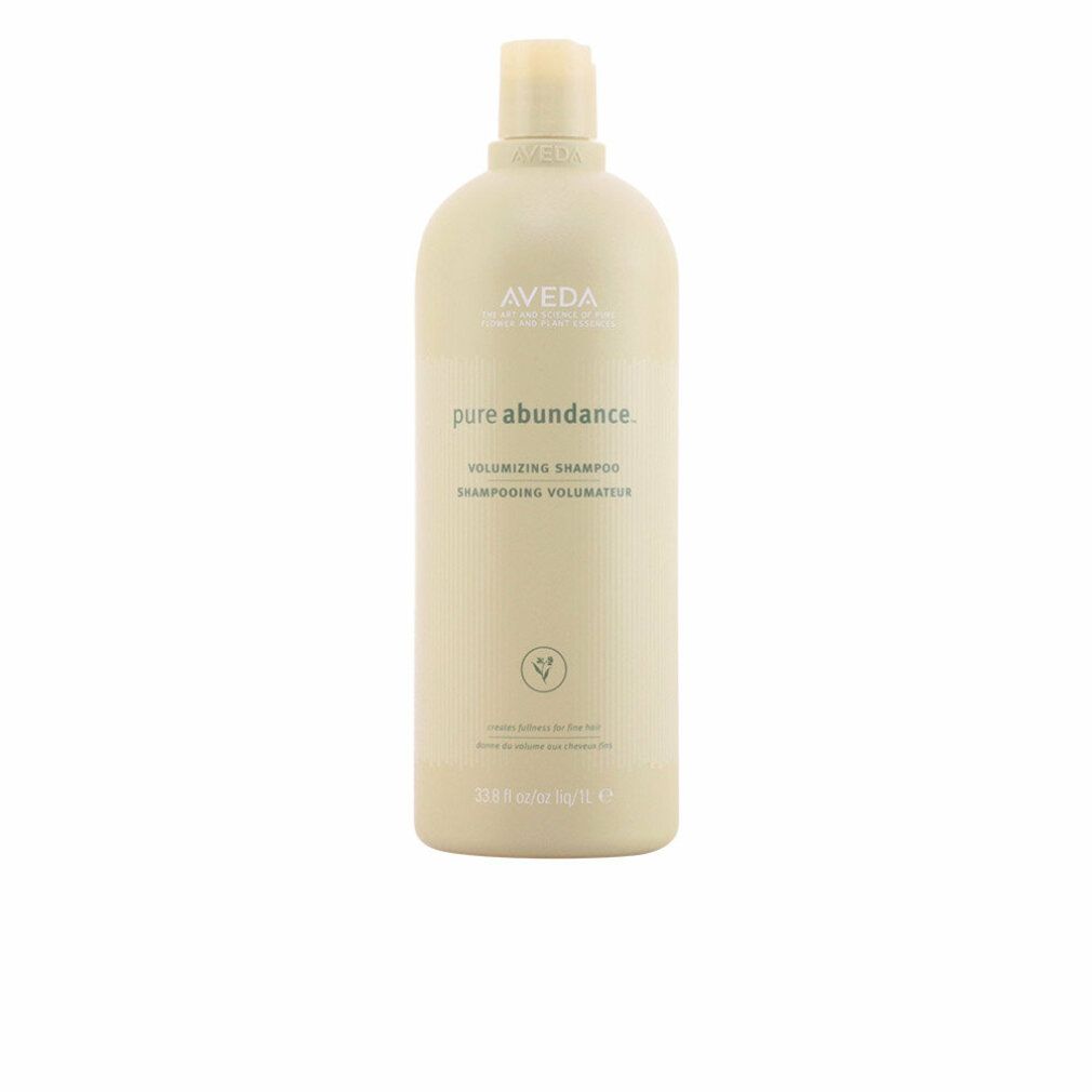 Beige Flasche mit Aveda-Logo und Produktnamen. Text: Pure Abundance Volumizing Shampoo. Grüne Pflanzen-Illustration.