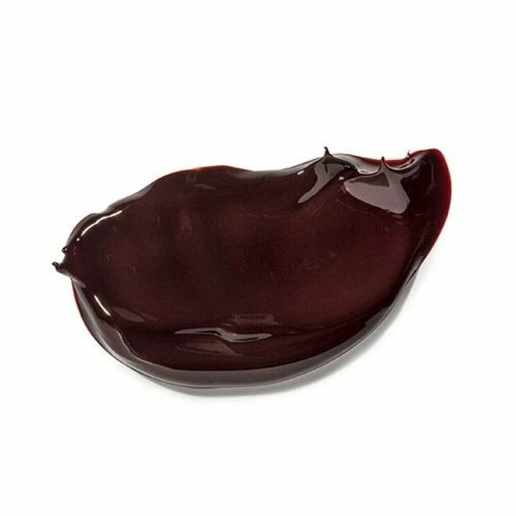 Klecks brauner Creme auf weißem Hintergrund. Glänzende Textur.