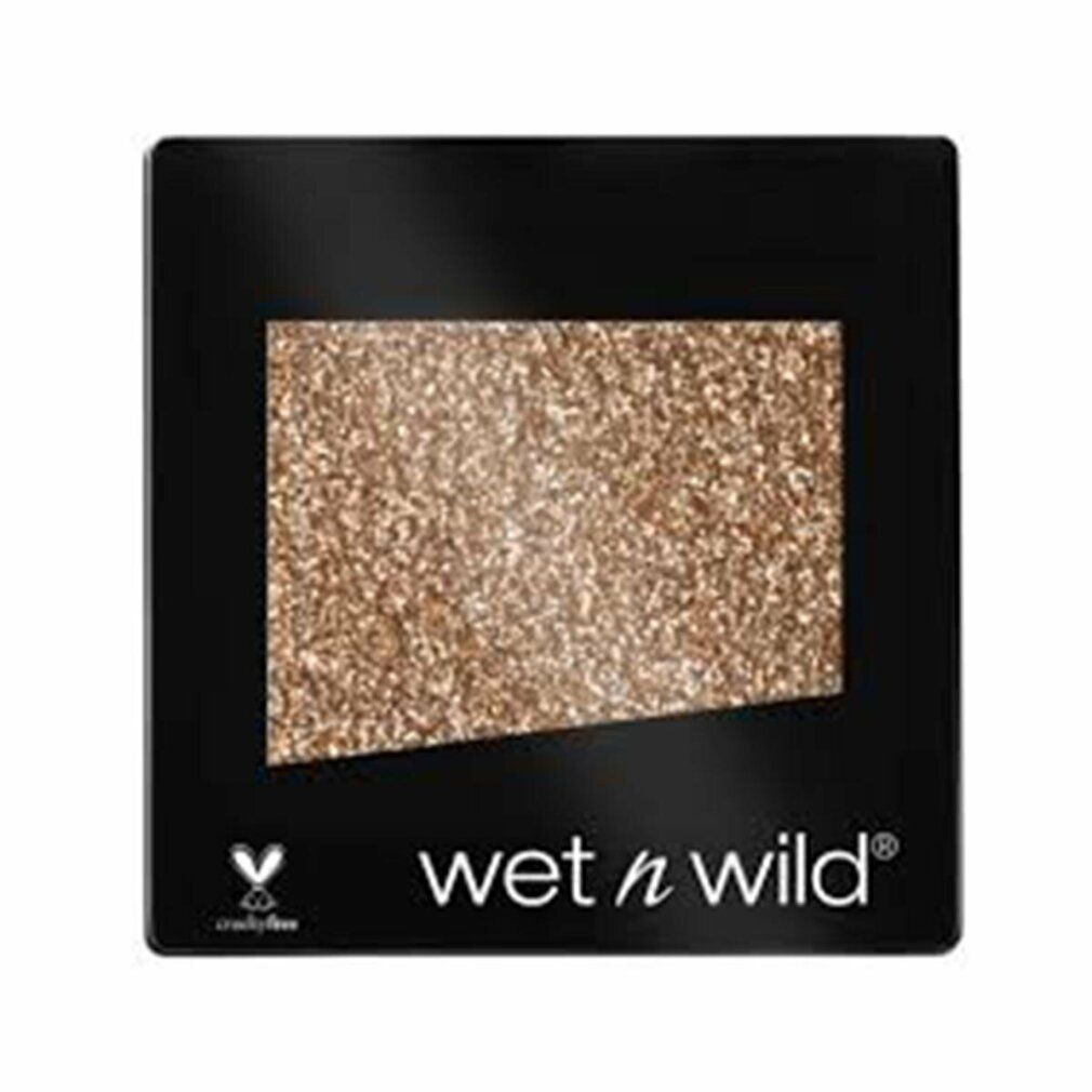 Quadratischer Lidschatten mit goldfarbenem Glitzer. Schwarze Verpackung mit "wet n wild" und Cruelty Free Logo.