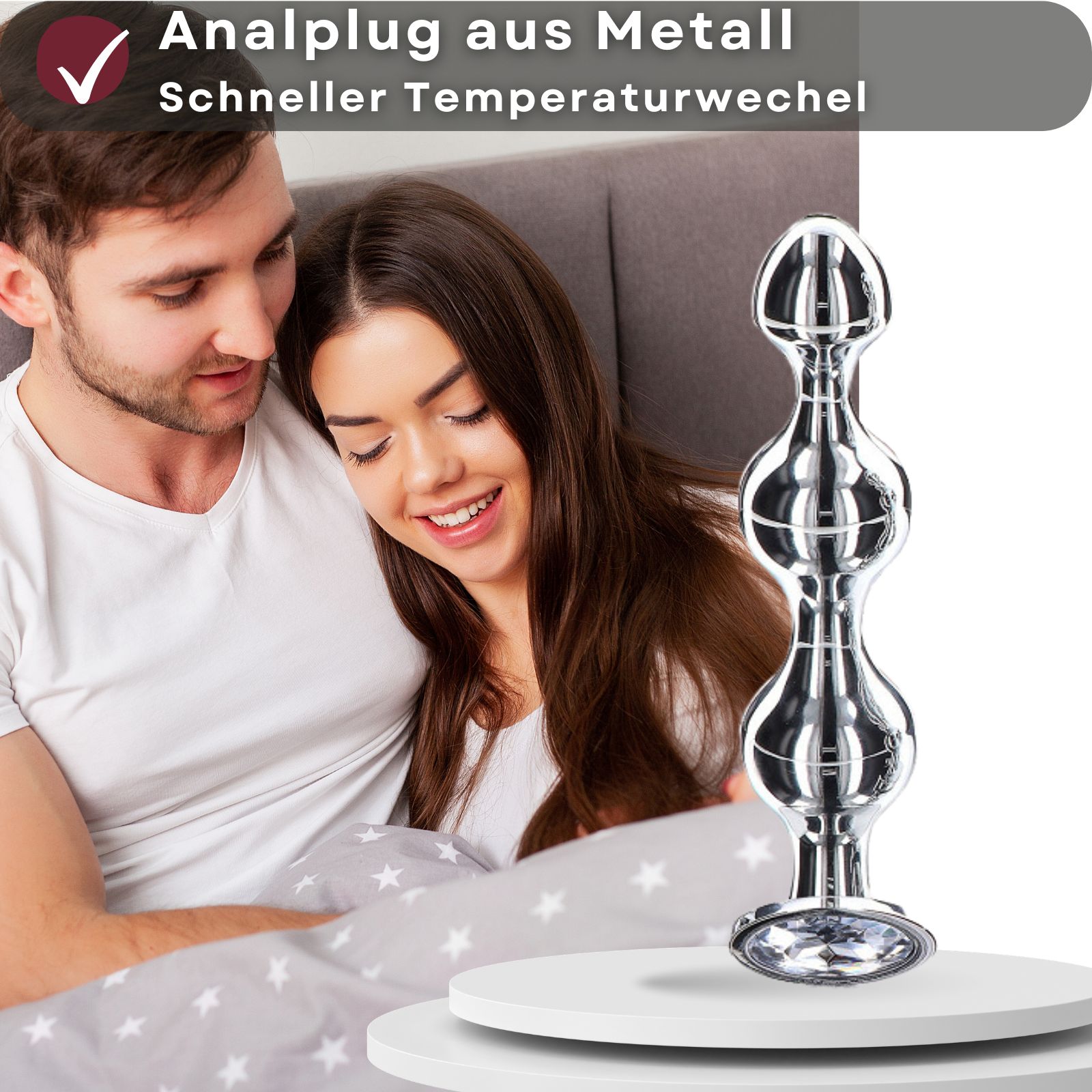 Analplug aus Metall. Schneller Temperaturwechsel. Produktabbildung vor Paar. Konische Form.