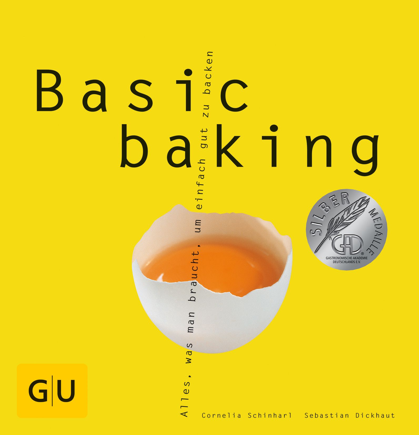 Buchcover mit Titel "Basic baking". Gelber Hintergrund, Ei mit Eigelb, Silbermedaille, GU-Logo. Autoren: Cornelia Schinhart, Sebastian Dickhaut.