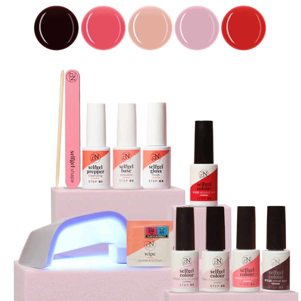 Nagelpflege-Set mit UV-Lampe, Nagellacken und Zubehör. Enthält Flaschen mit Aufschriften wie "selfgel prepper", "base", "colour", "gloss".