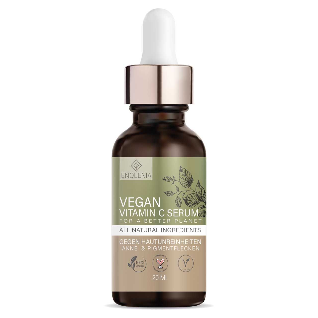 Braune Glasflasche mit Pipette. Aufschrift: Vegan Vitamin C Serum. 20 ml. Mit grünen Etikett und Blättermotiv.